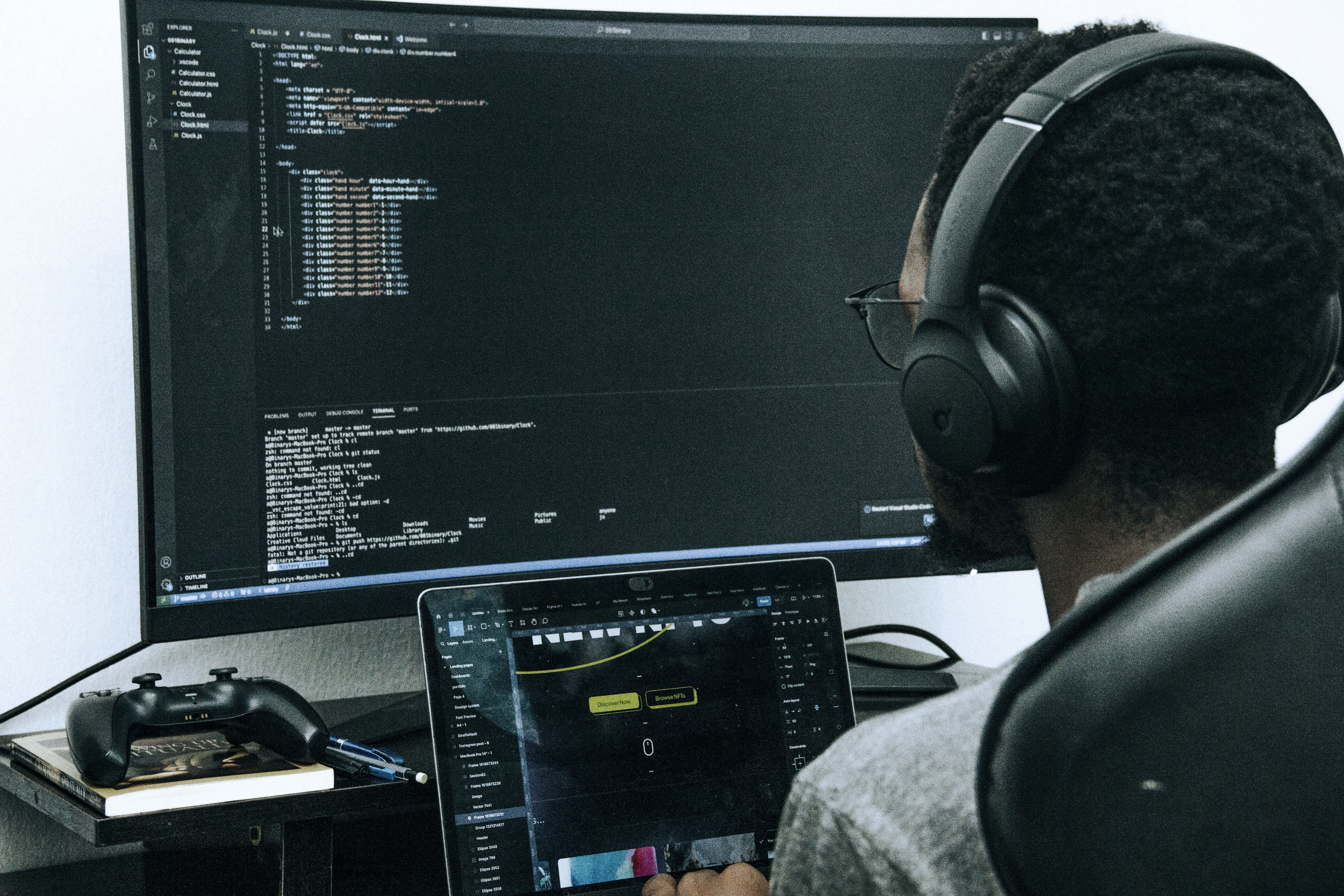 A developer with headphones working in a terminal