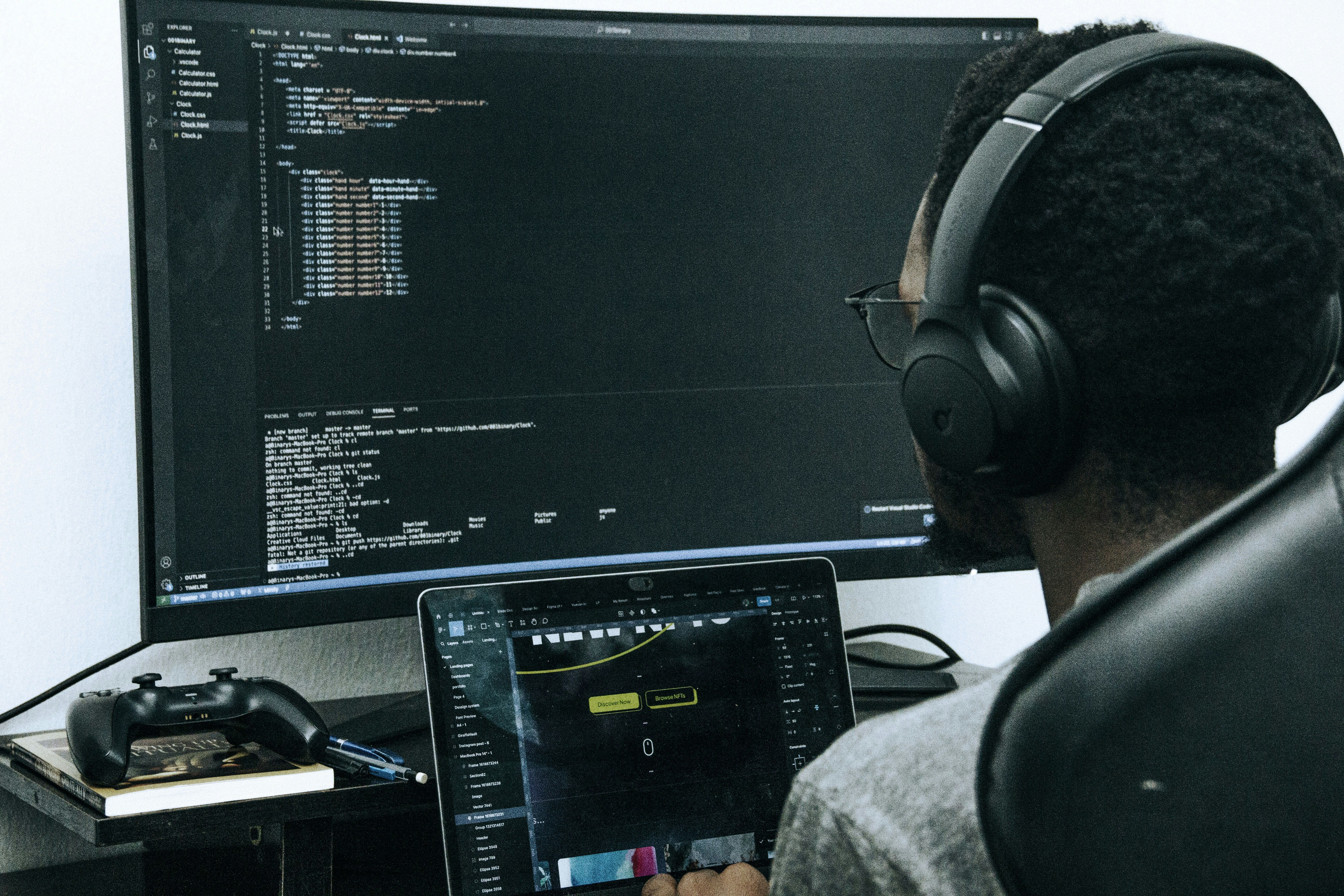 software developer analyzing system code on dual monitors