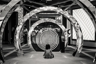 A woman sitting on the floor of a building