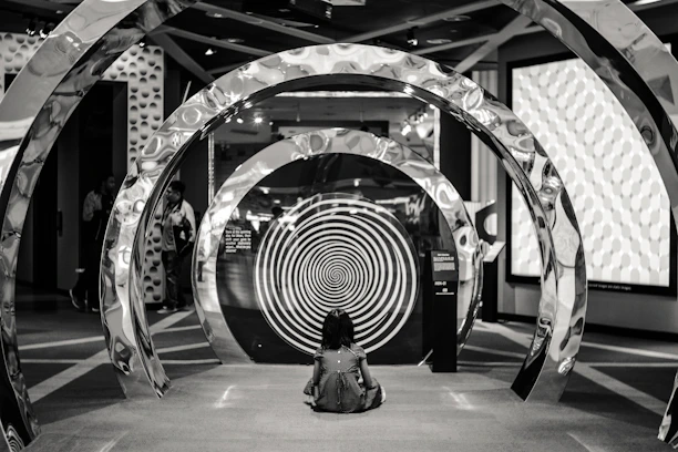 A woman sitting on the floor of a building