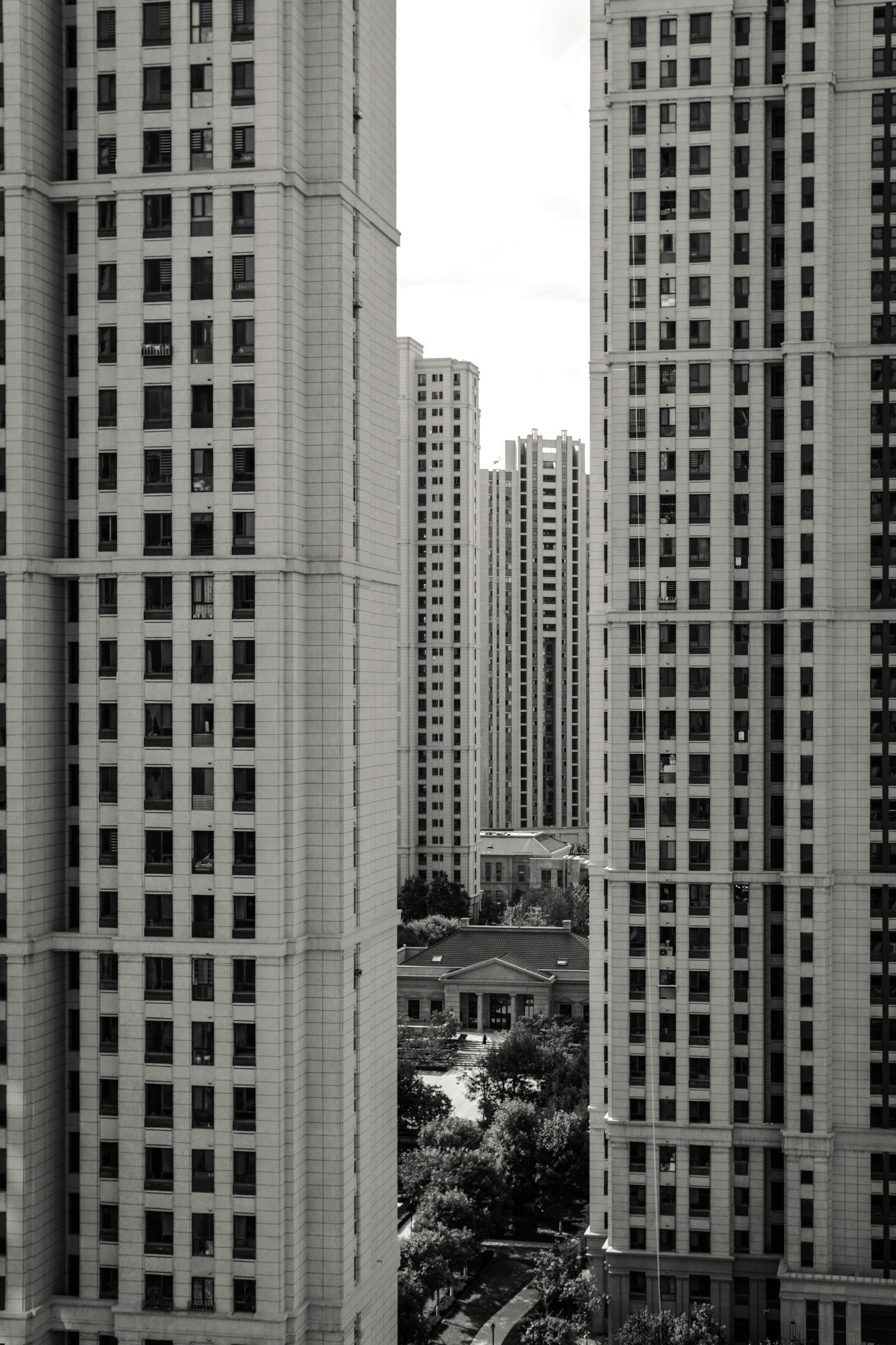 A black and white photo of tall buildings