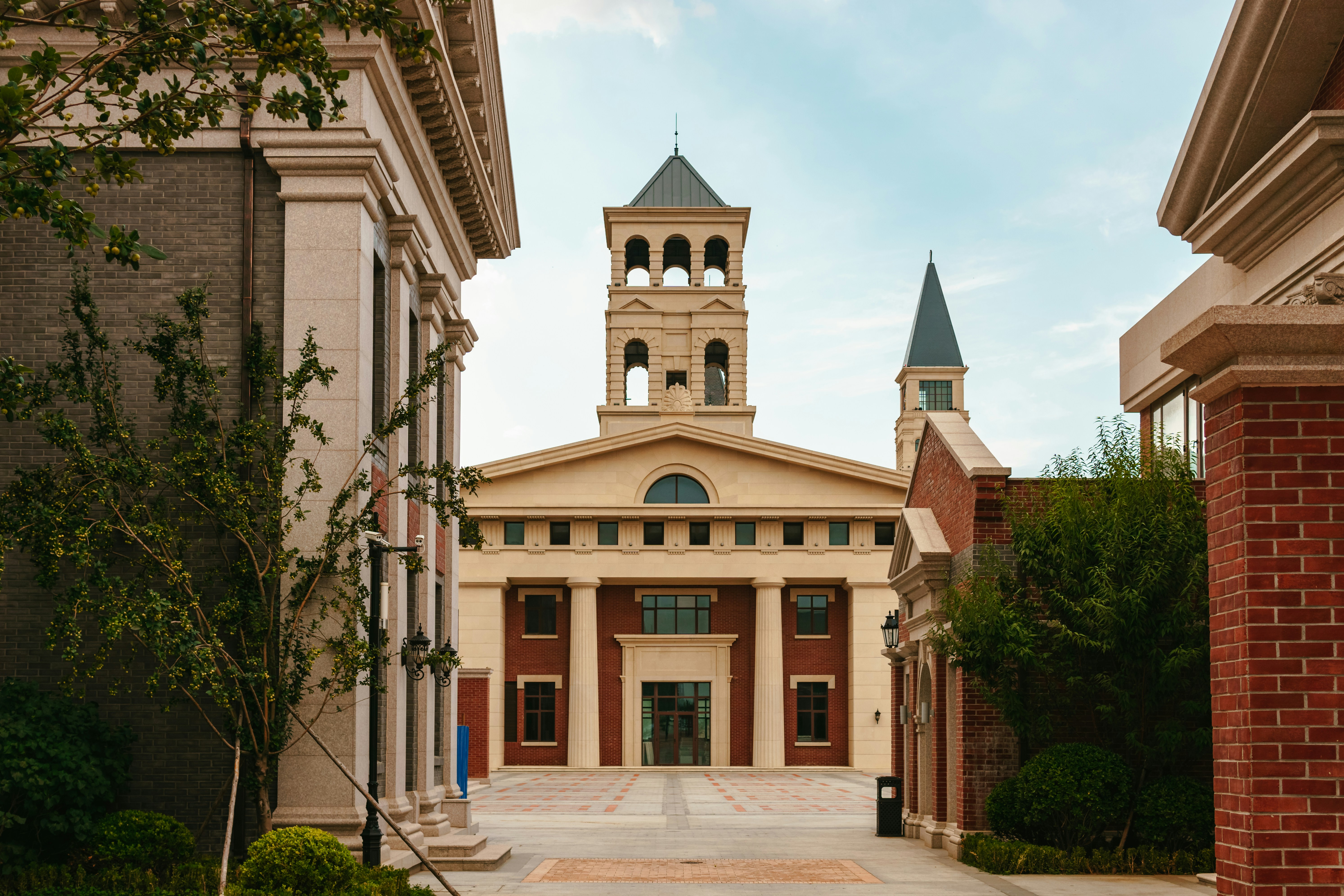A large building with a clock tower on top of it photo – Free Travel ...