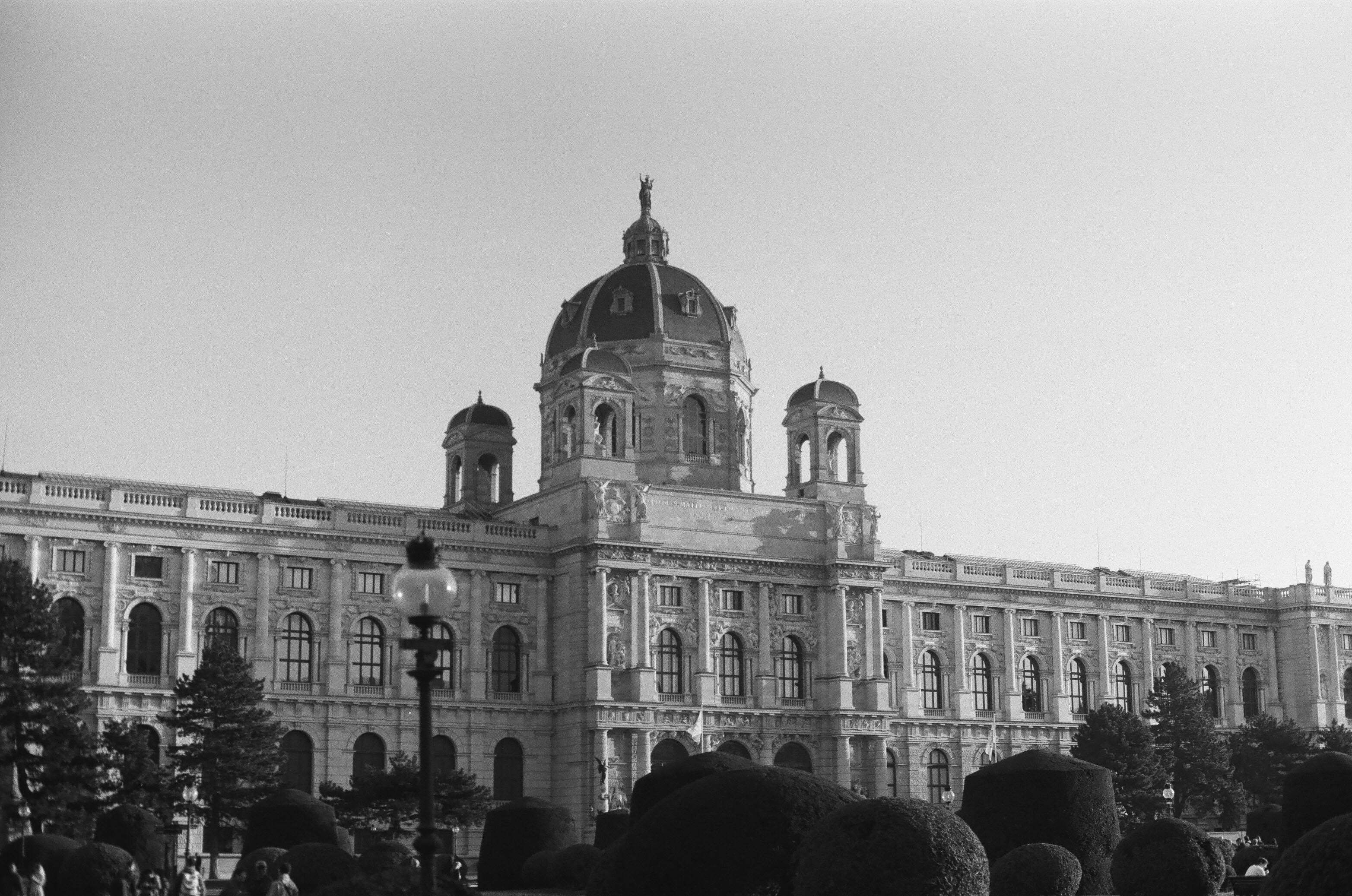 A crowd of people standing in front of a large building