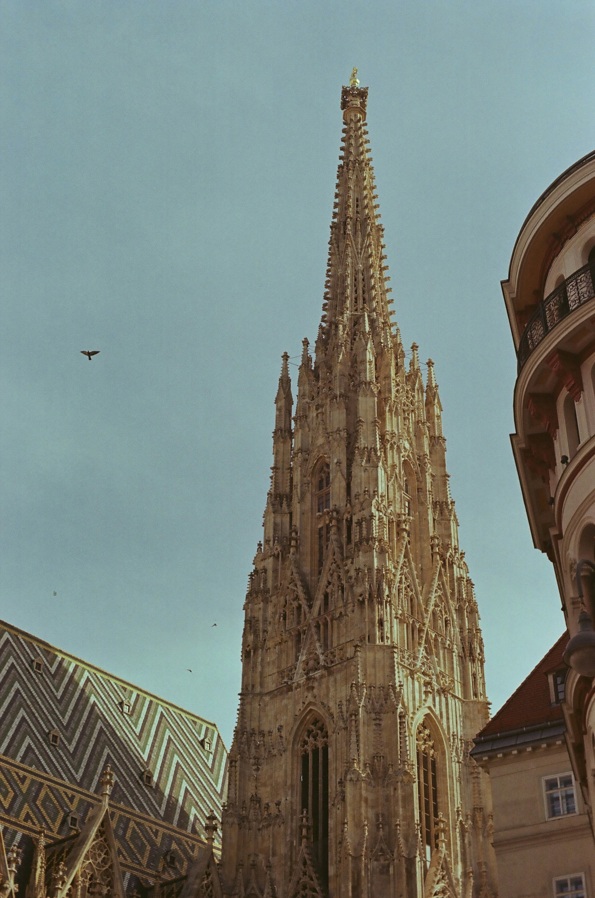 A very tall building with a clock on it's side