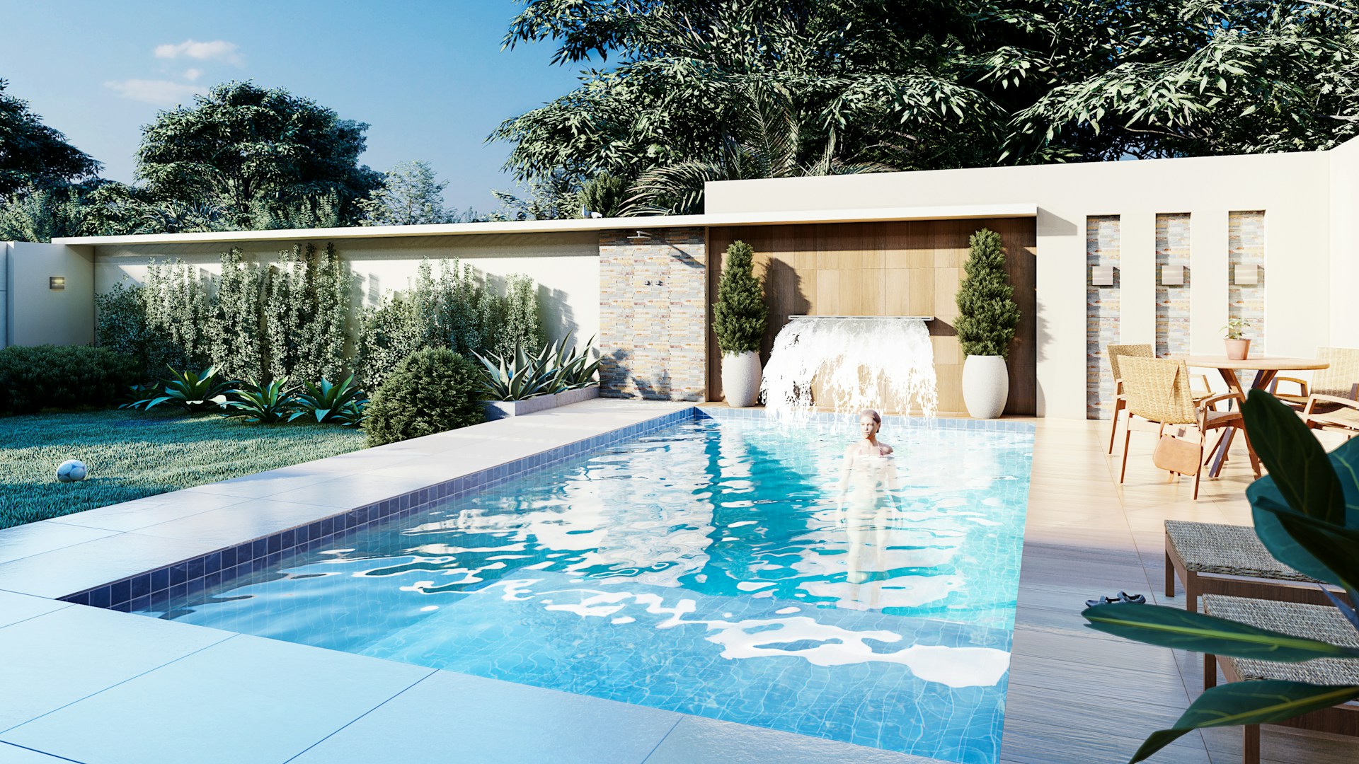 A swimming pool surrounded by a lush green yard