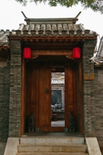 A building with a wooden door and steps leading up to it