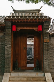 A building with a wooden door and steps leading up to it