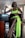 A woman in a neon green dress sitting at a table