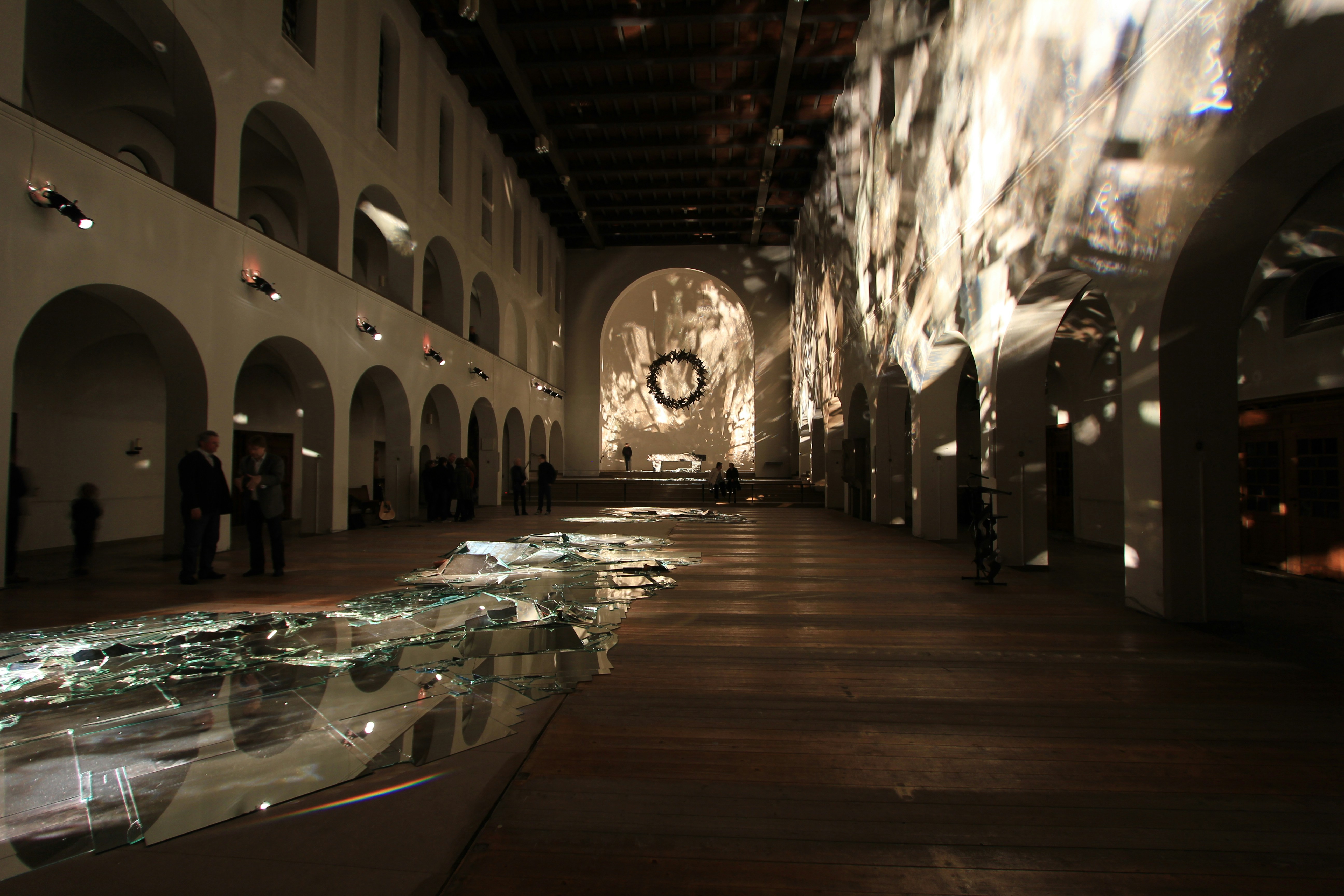 A long hallway with a clock on the wall