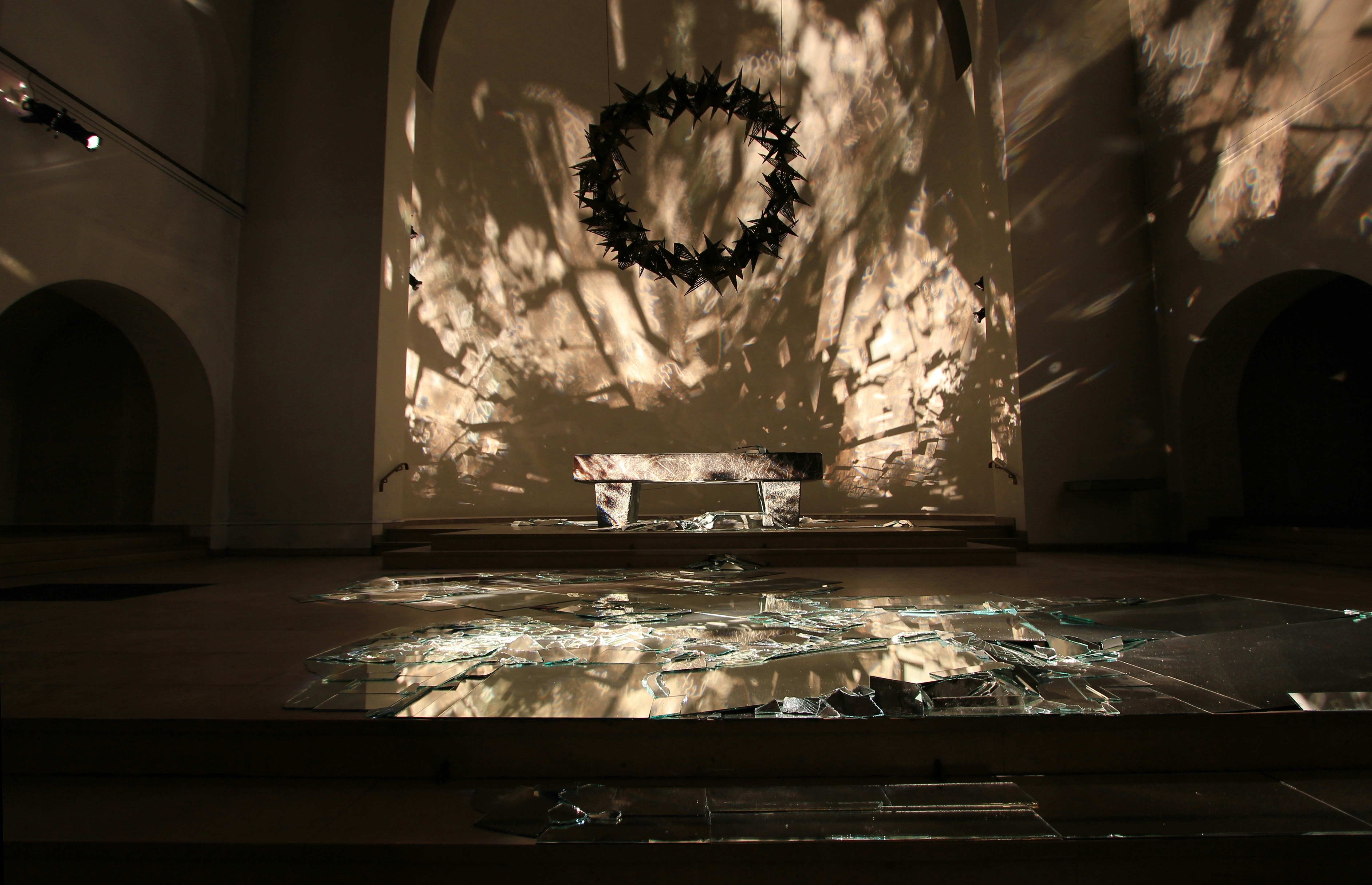 A room with a light shining on the floor