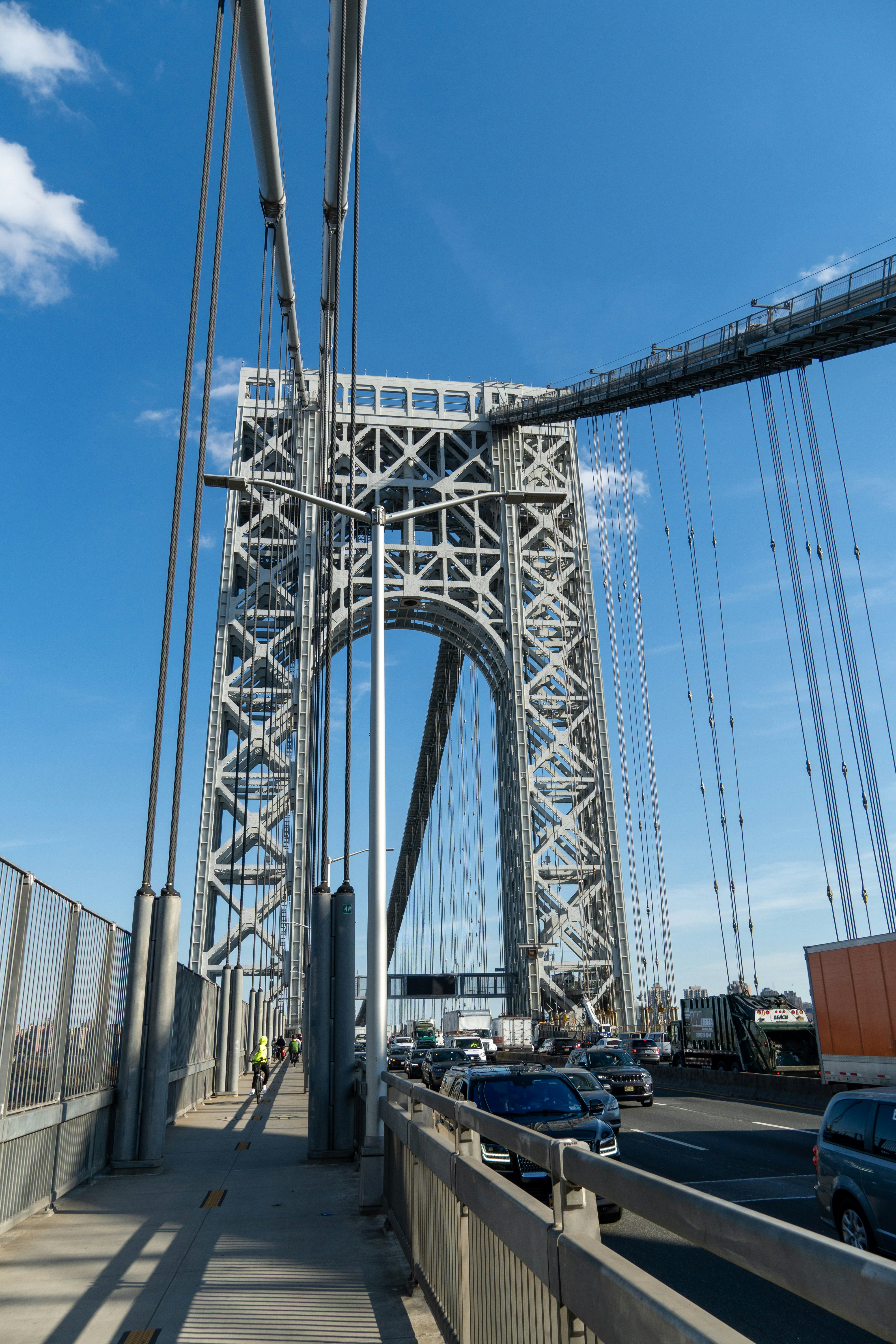 A view of a bridge with cars going over it