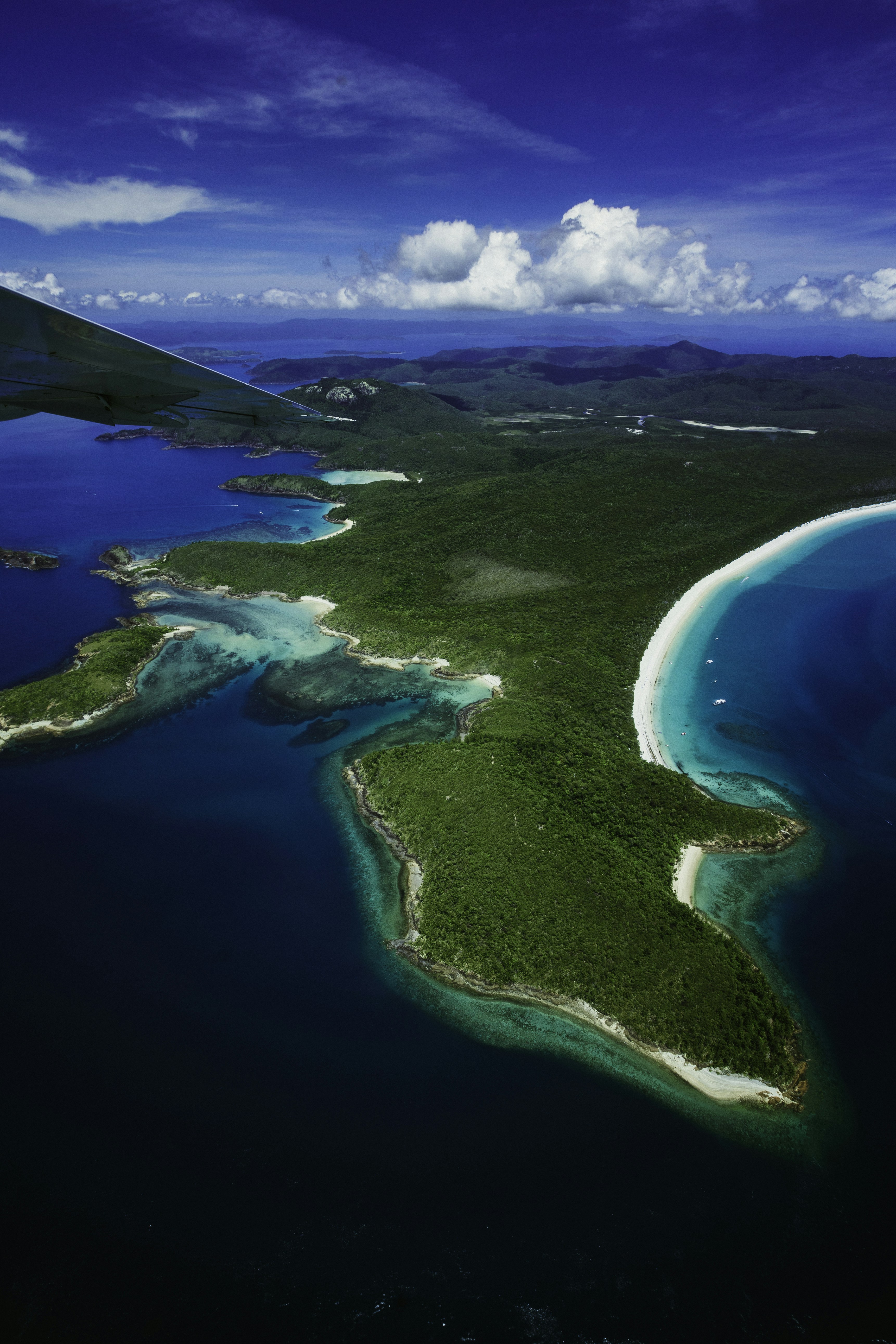 An aerial view of an island in the ocean photo – Free Land Image on ...