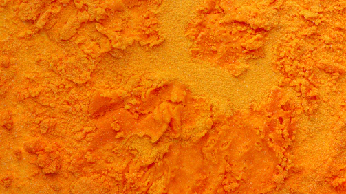 A close up of a yellow powdered substance