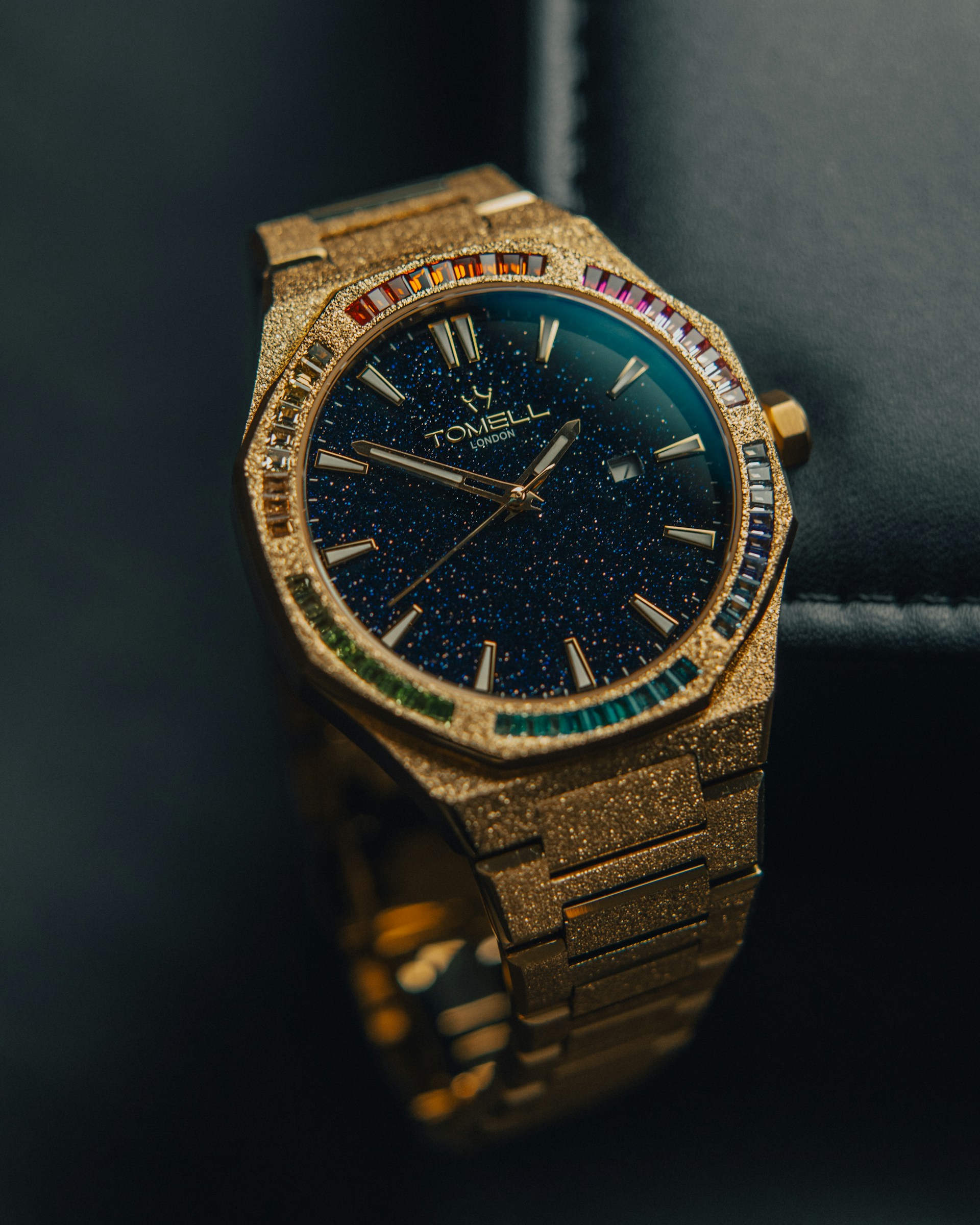 A watch sitting on top of a black case