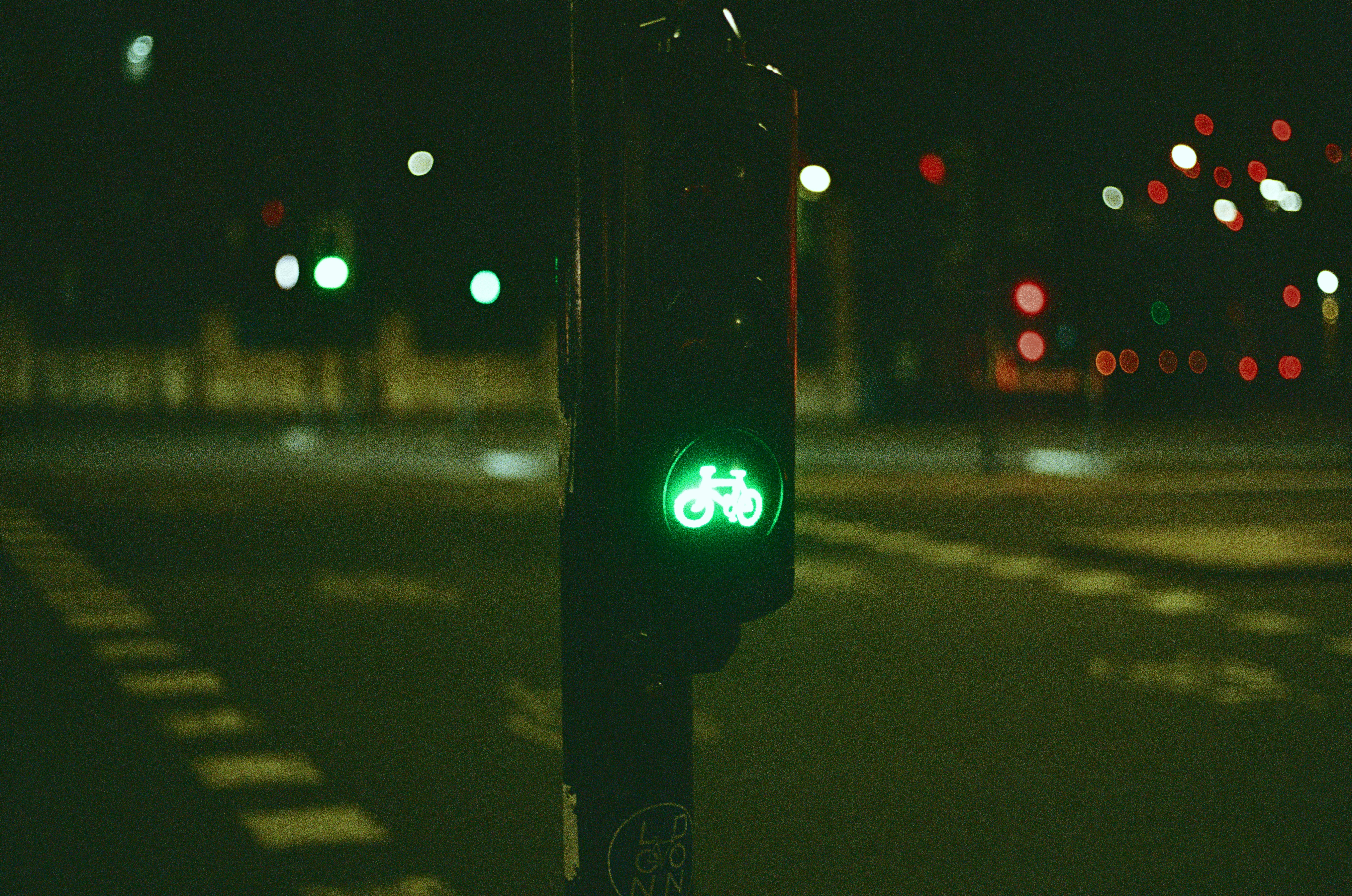 A green traffic light sitting on the side of a road