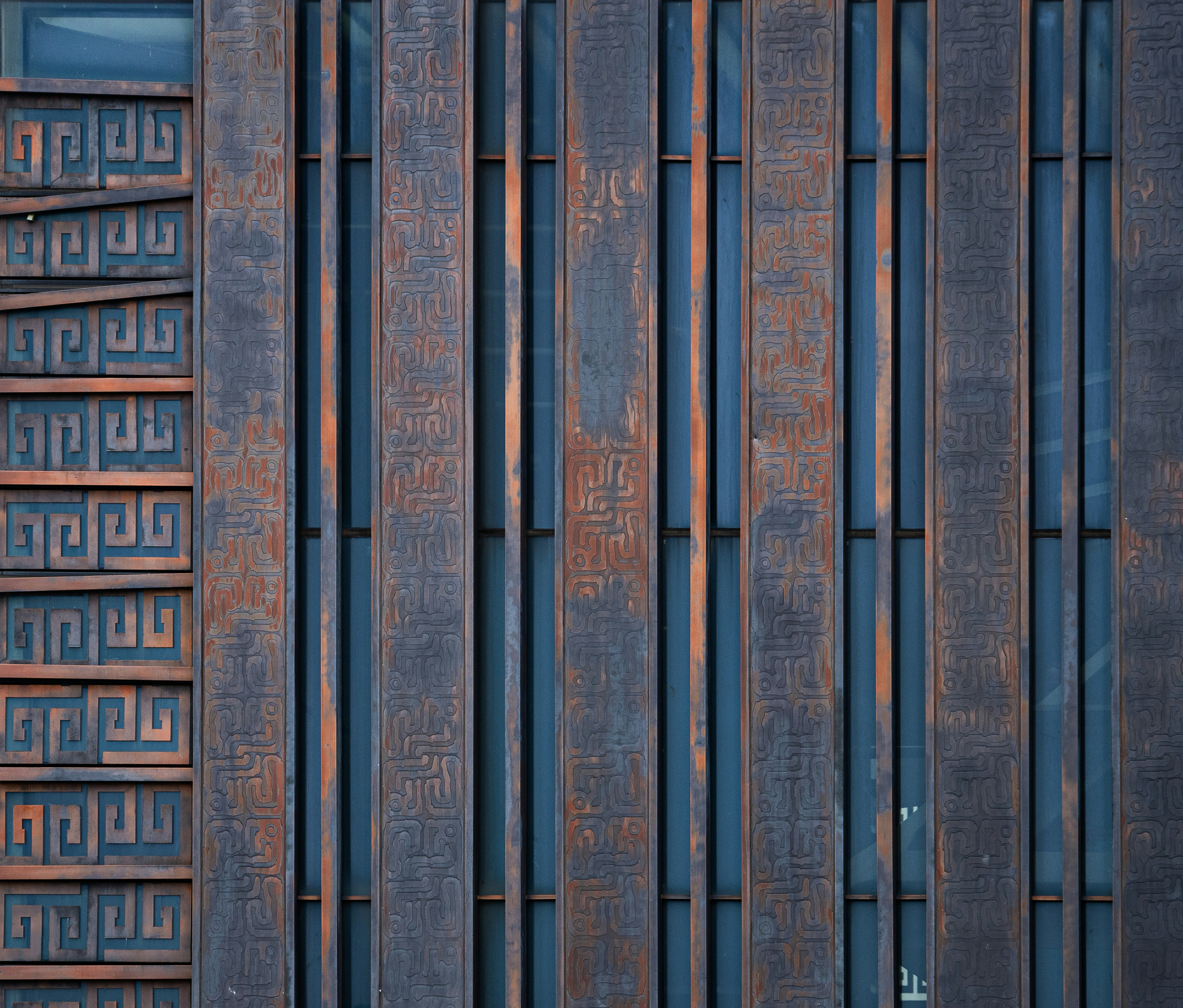 Red fire hydrant next to building