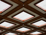 The ceiling of a building with many square windows