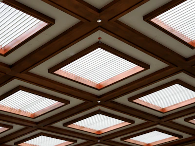 The ceiling of a building with many square windows