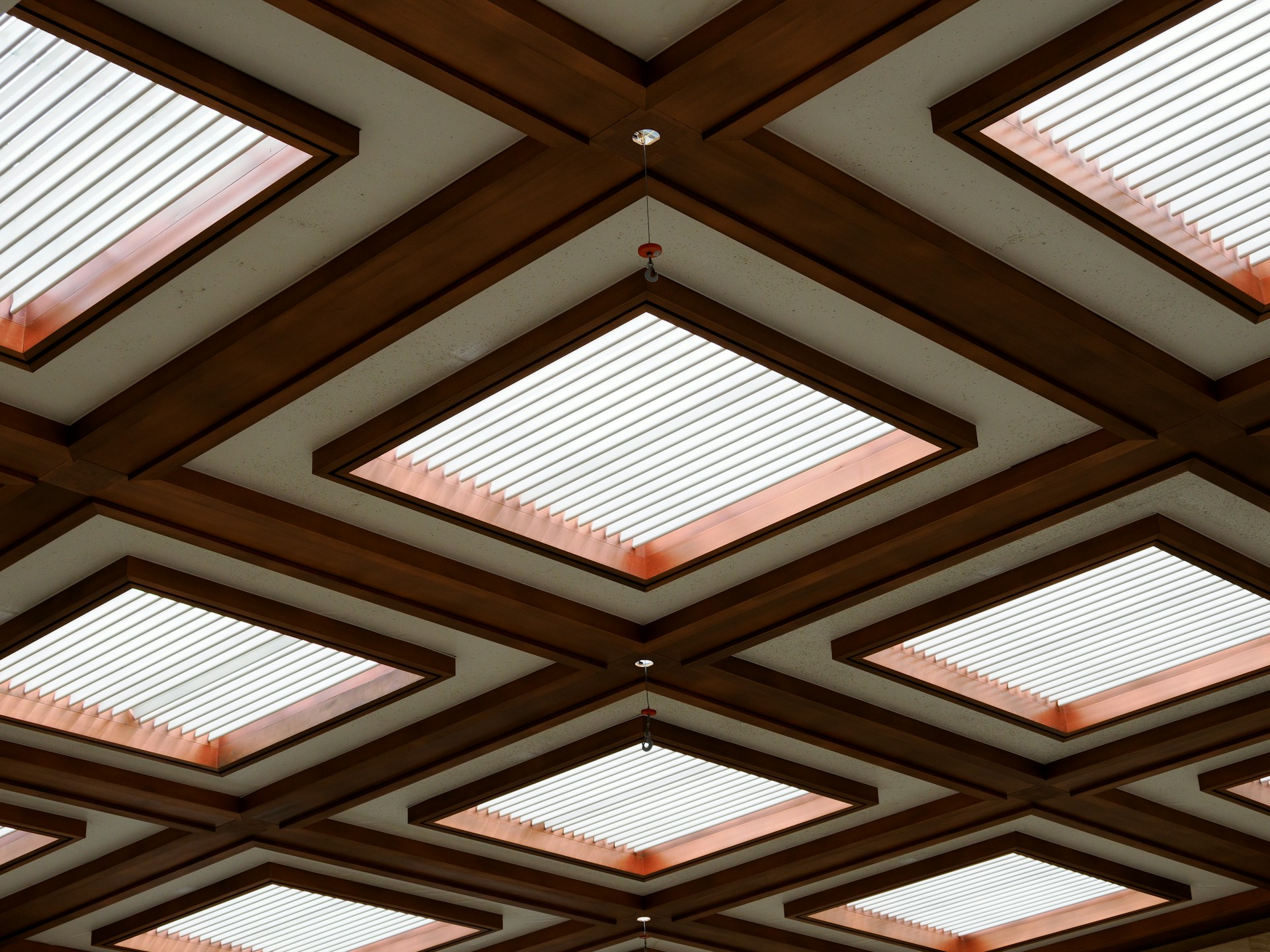 The ceiling of a building with many square windows
