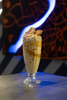 A glass of ice cream with cookies on top