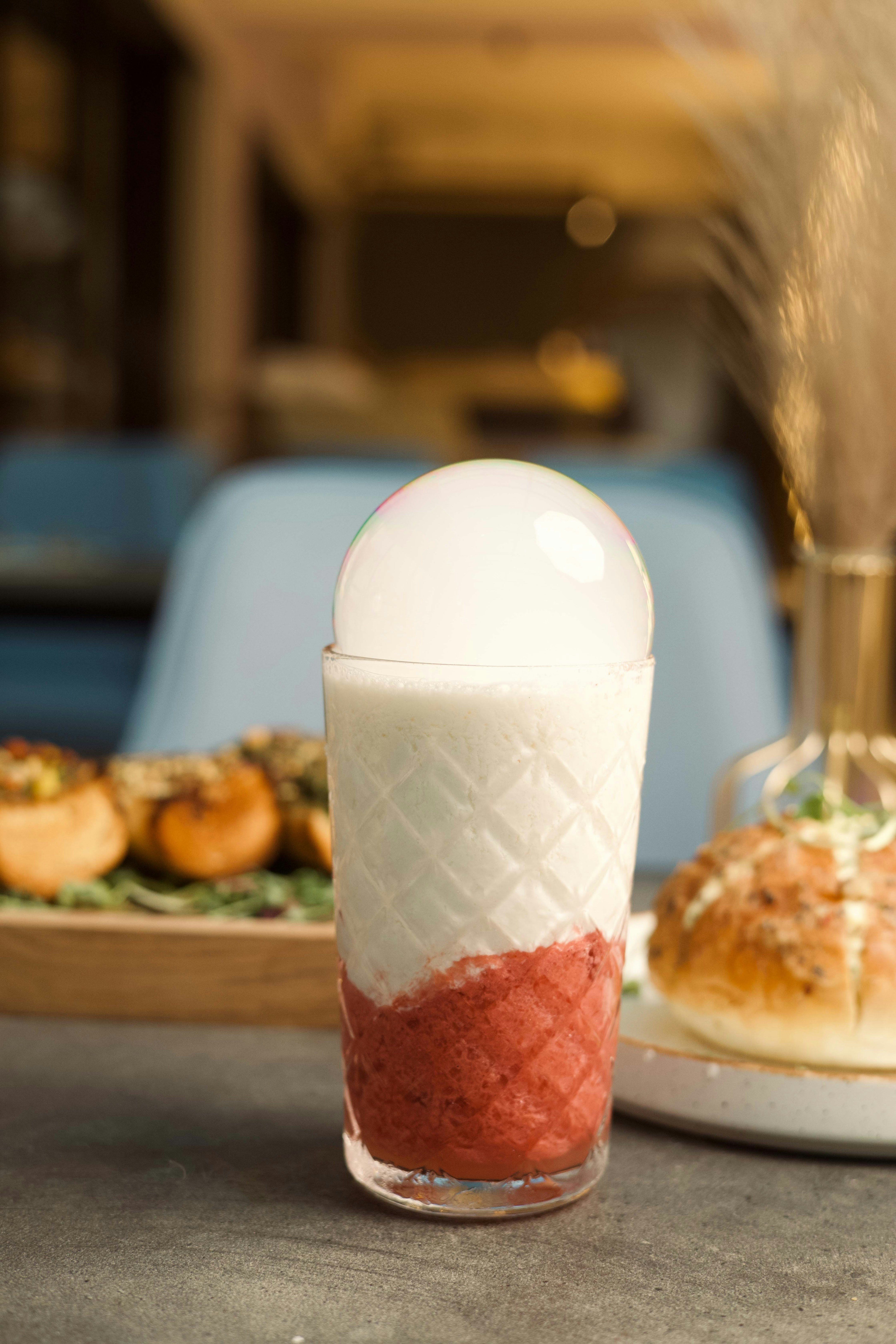 A table topped with a plate of food and a drink