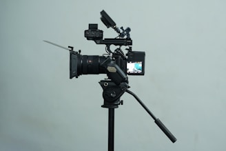 A tripod with a camera attached to it