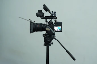 A tripod with a camera attached to it