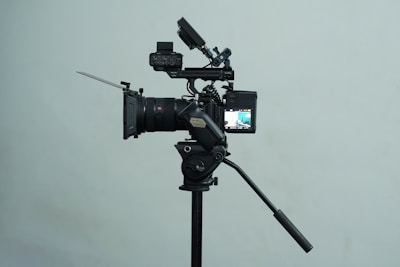 A tripod with a camera attached to it