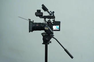 A tripod with a camera attached to it