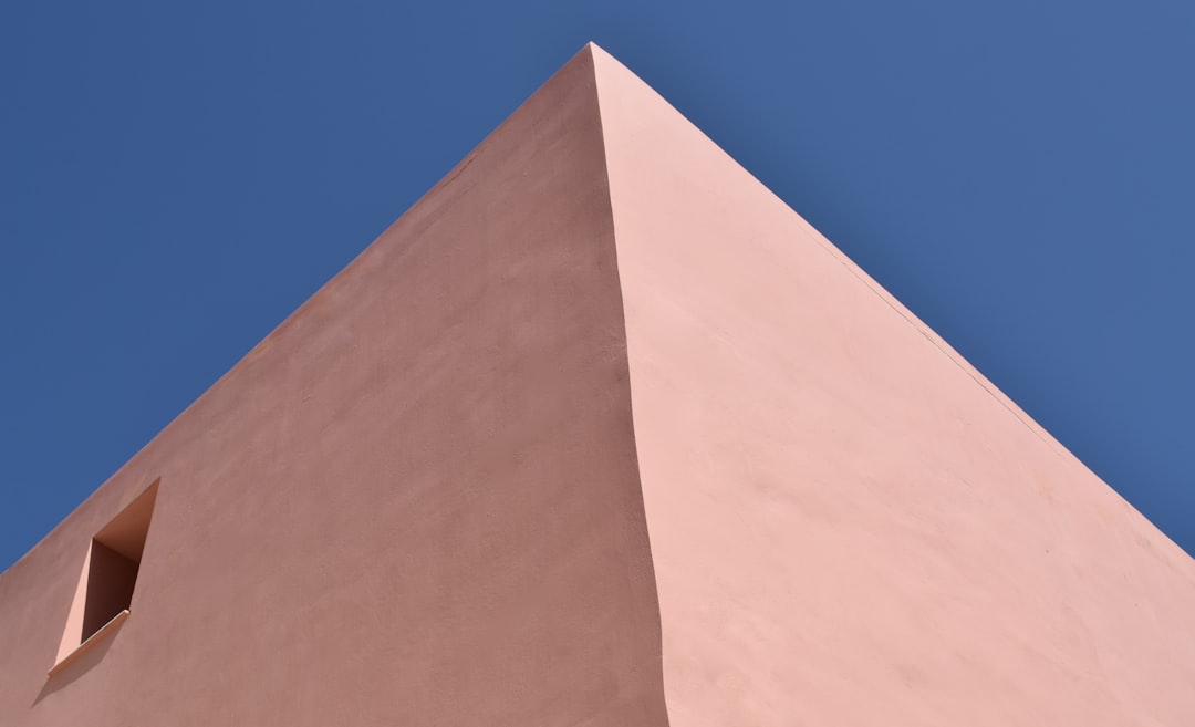 A tall building with a clock on the top of it, Experimental