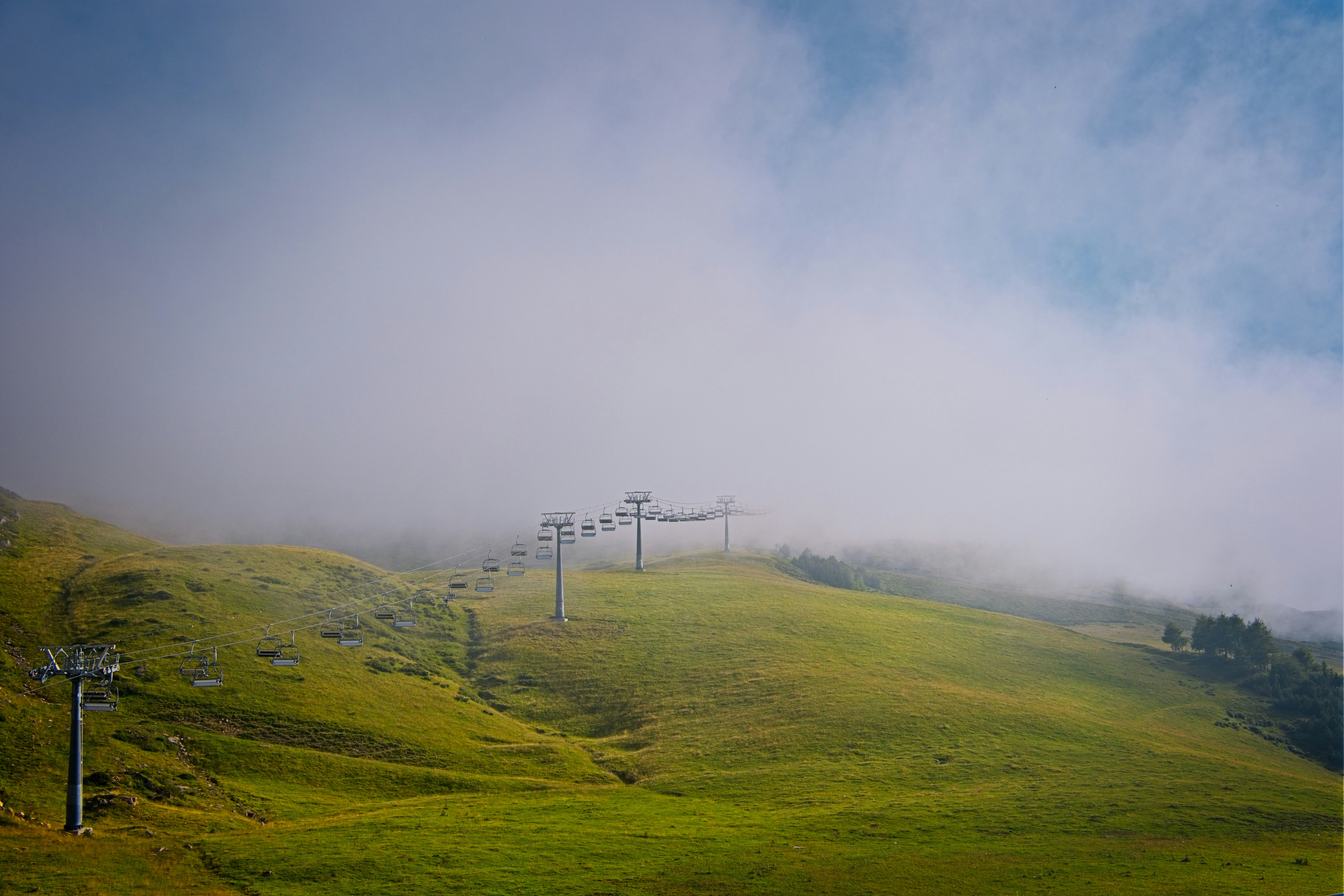 A foggy day at the top of a ski slope