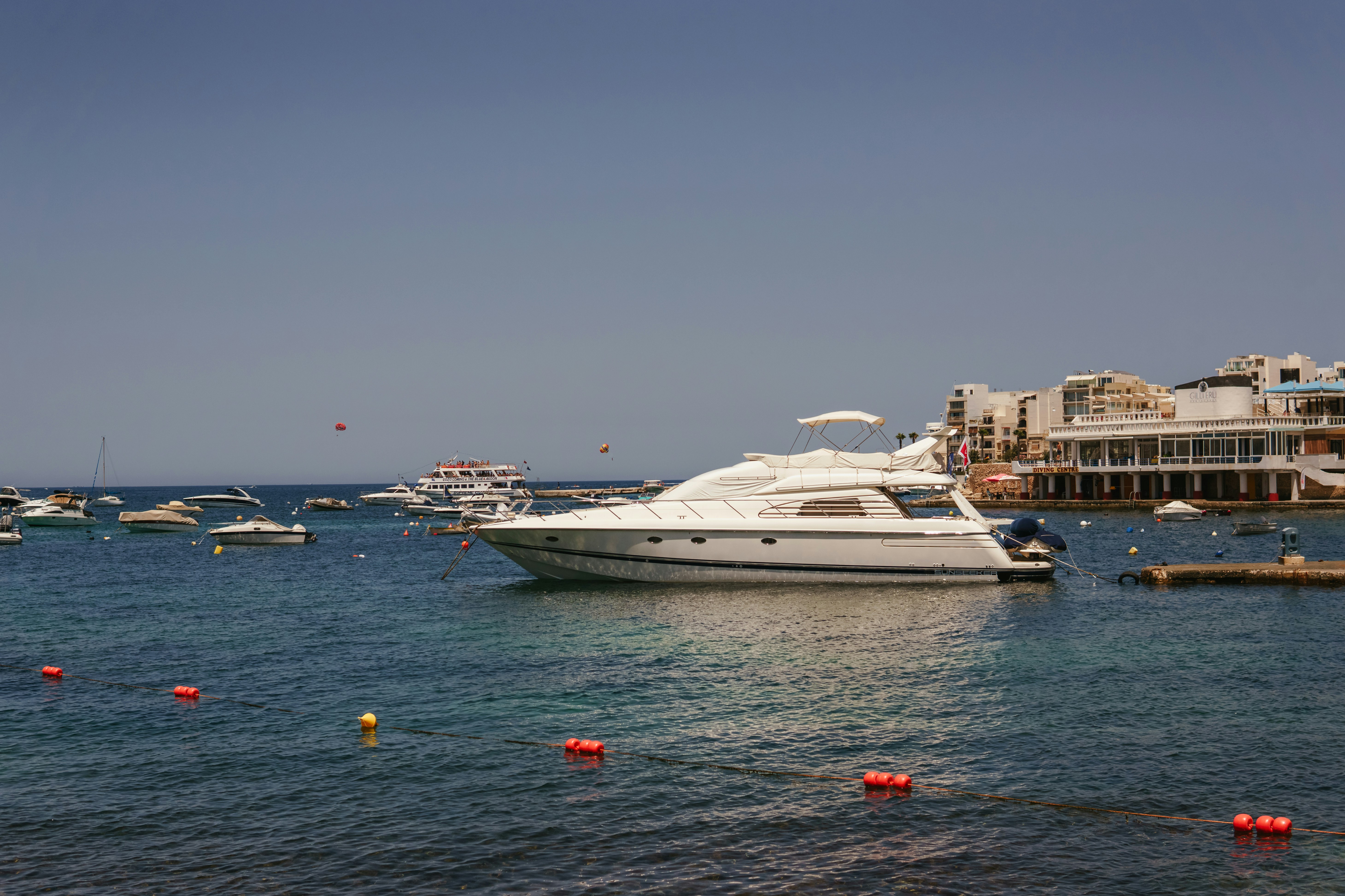A large white boat in the middle of a body of water