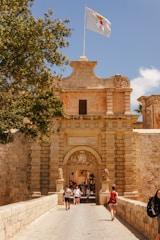 A group of people walking across a bridge