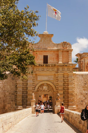 A group of people walking across a bridge