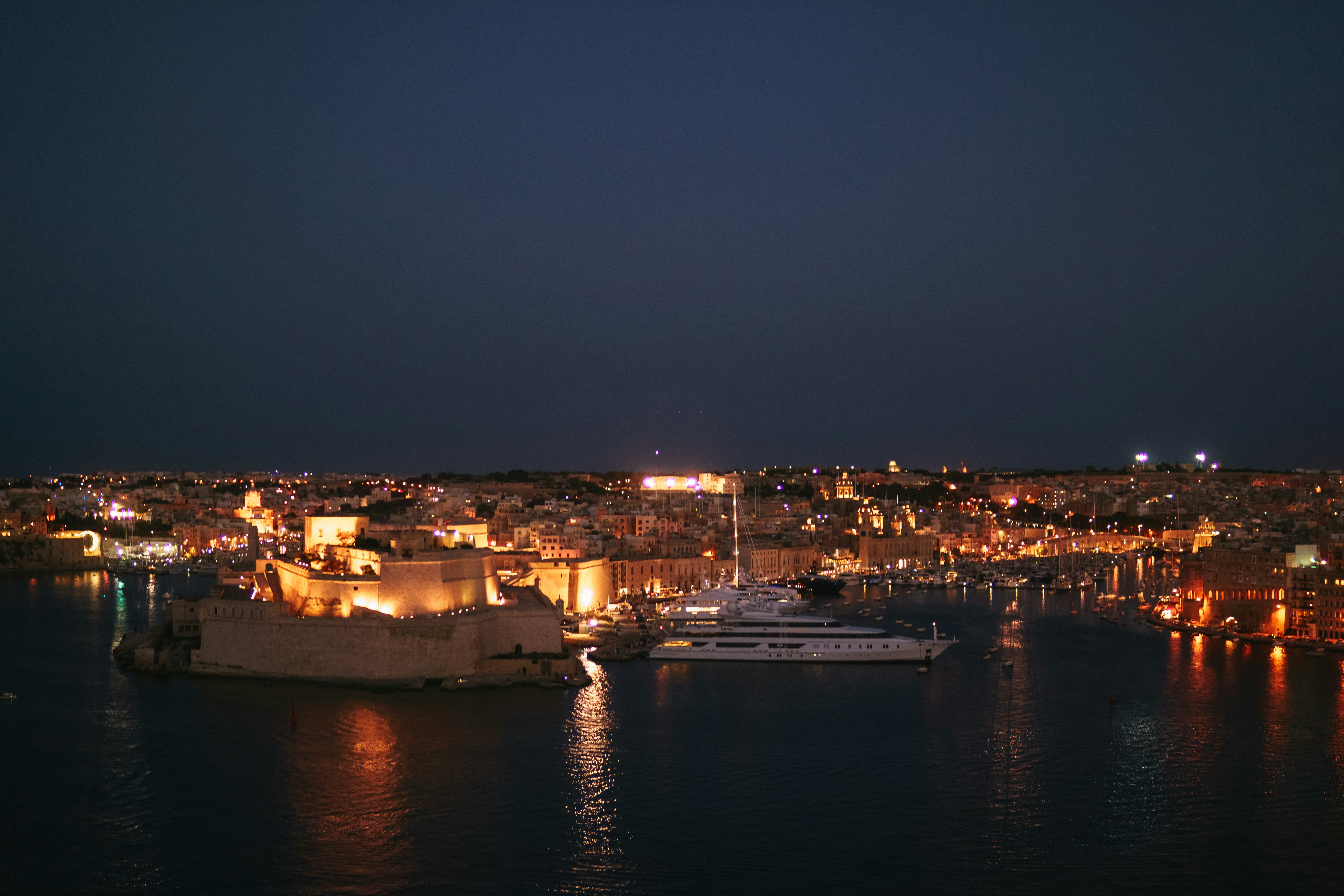 A night view of a city and a harbor