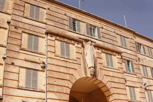 A large building with a clock on the front of it