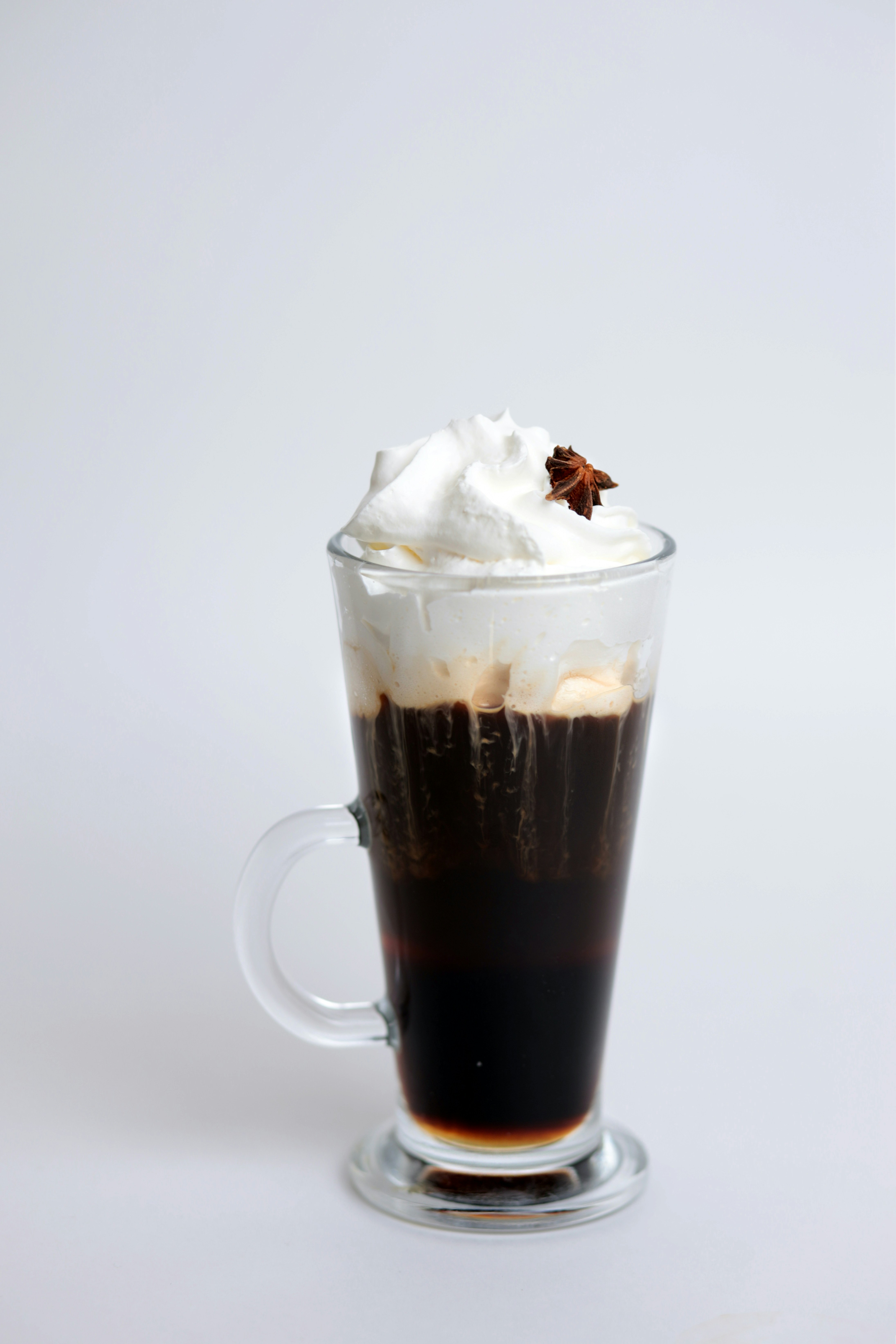 A cup of coffee with whipped cream on top