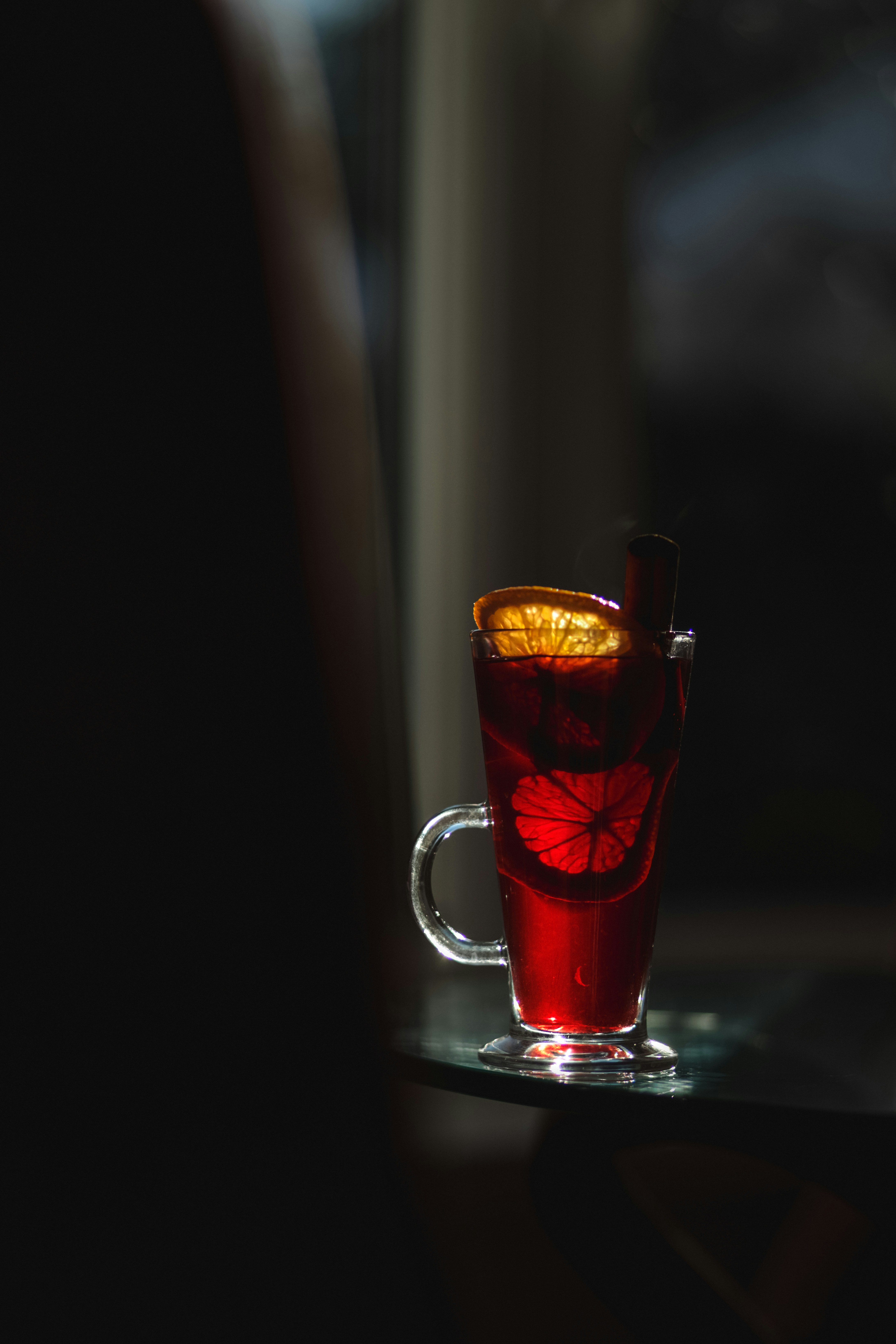 A glass of tea sitting on top of a table
