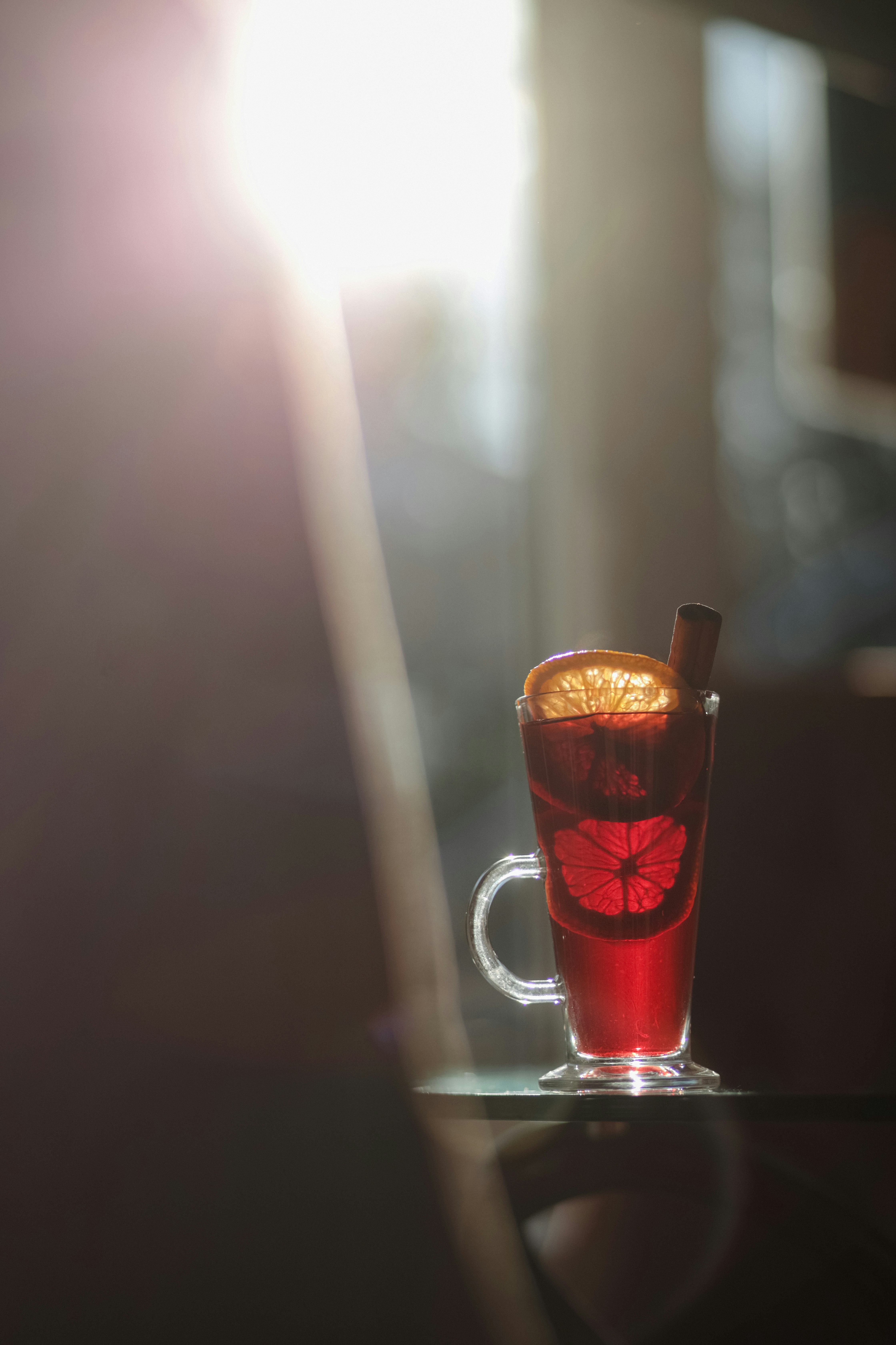 A glass with a drink on a table