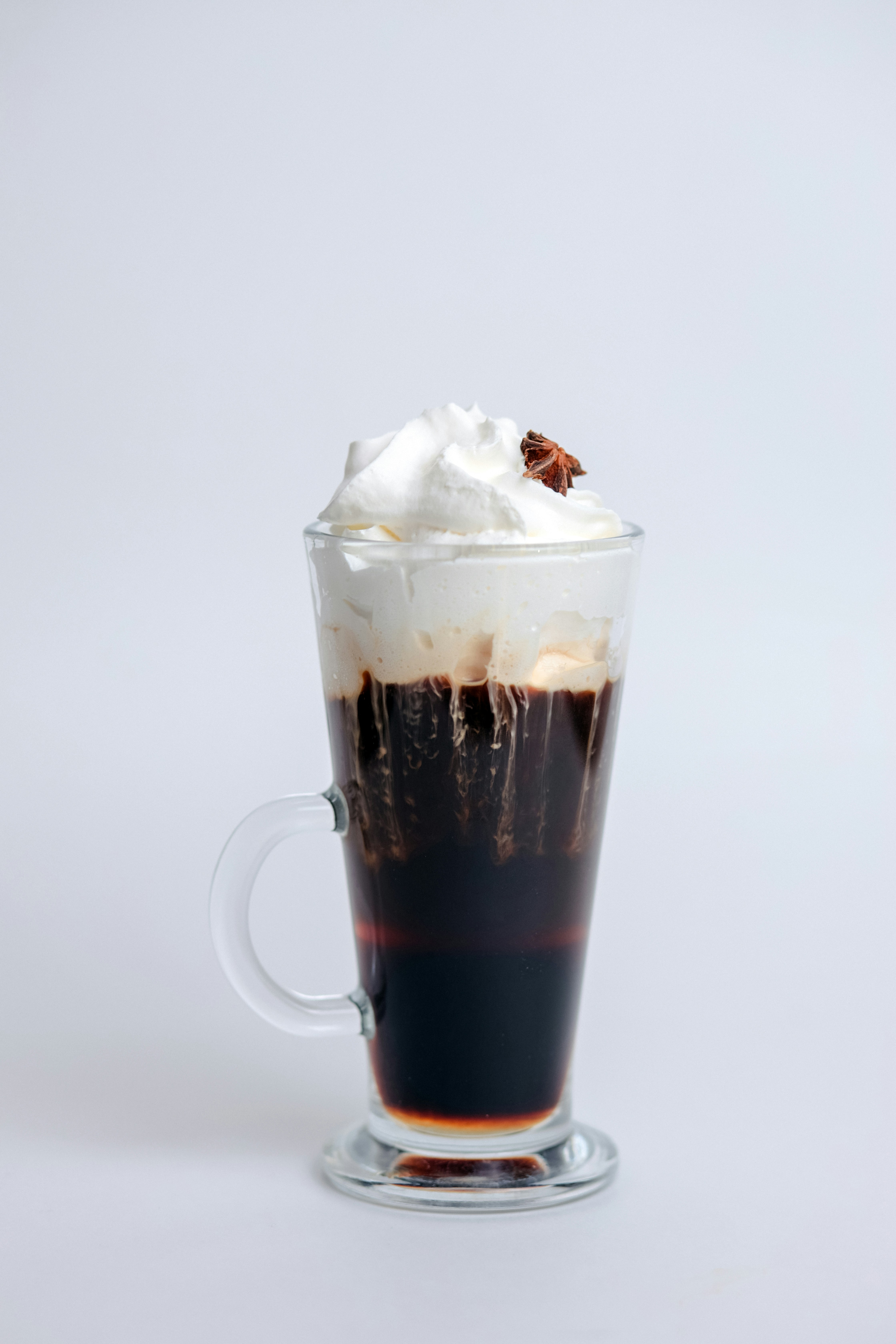 A cup of coffee with whipped cream on top