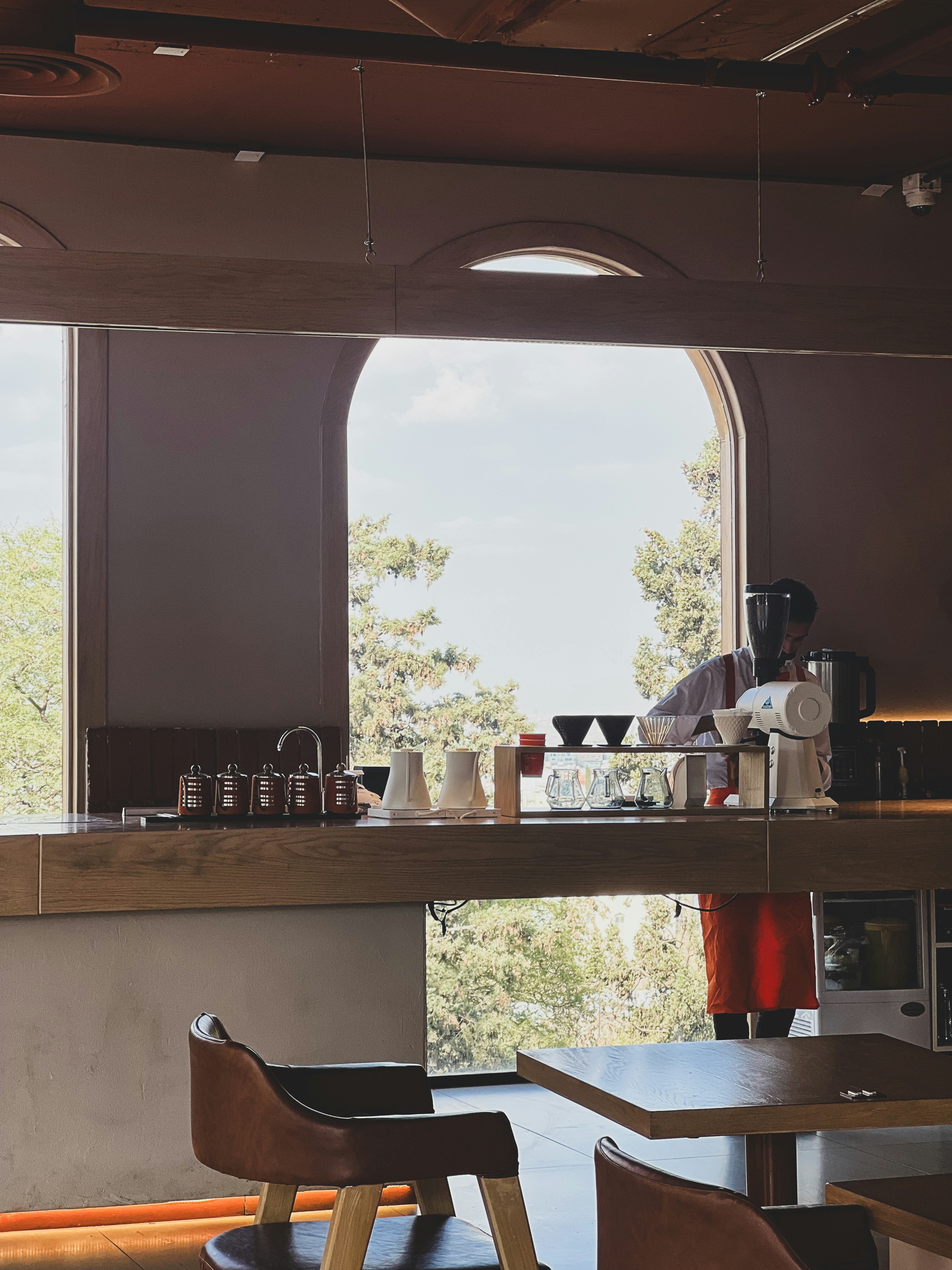 A restaurant with a large window and a long counter