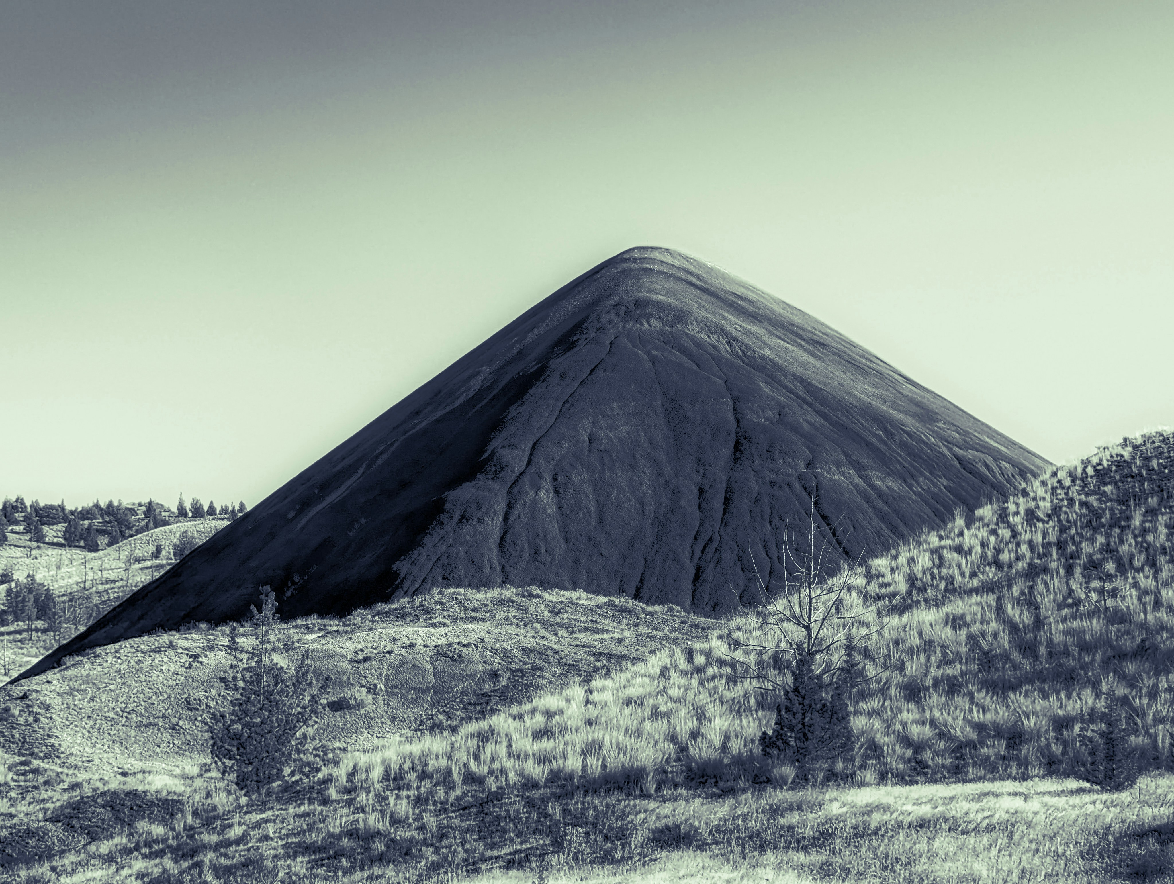 A black and white photo of a mountain