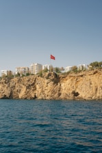 A large body of water with a red flag on top of it