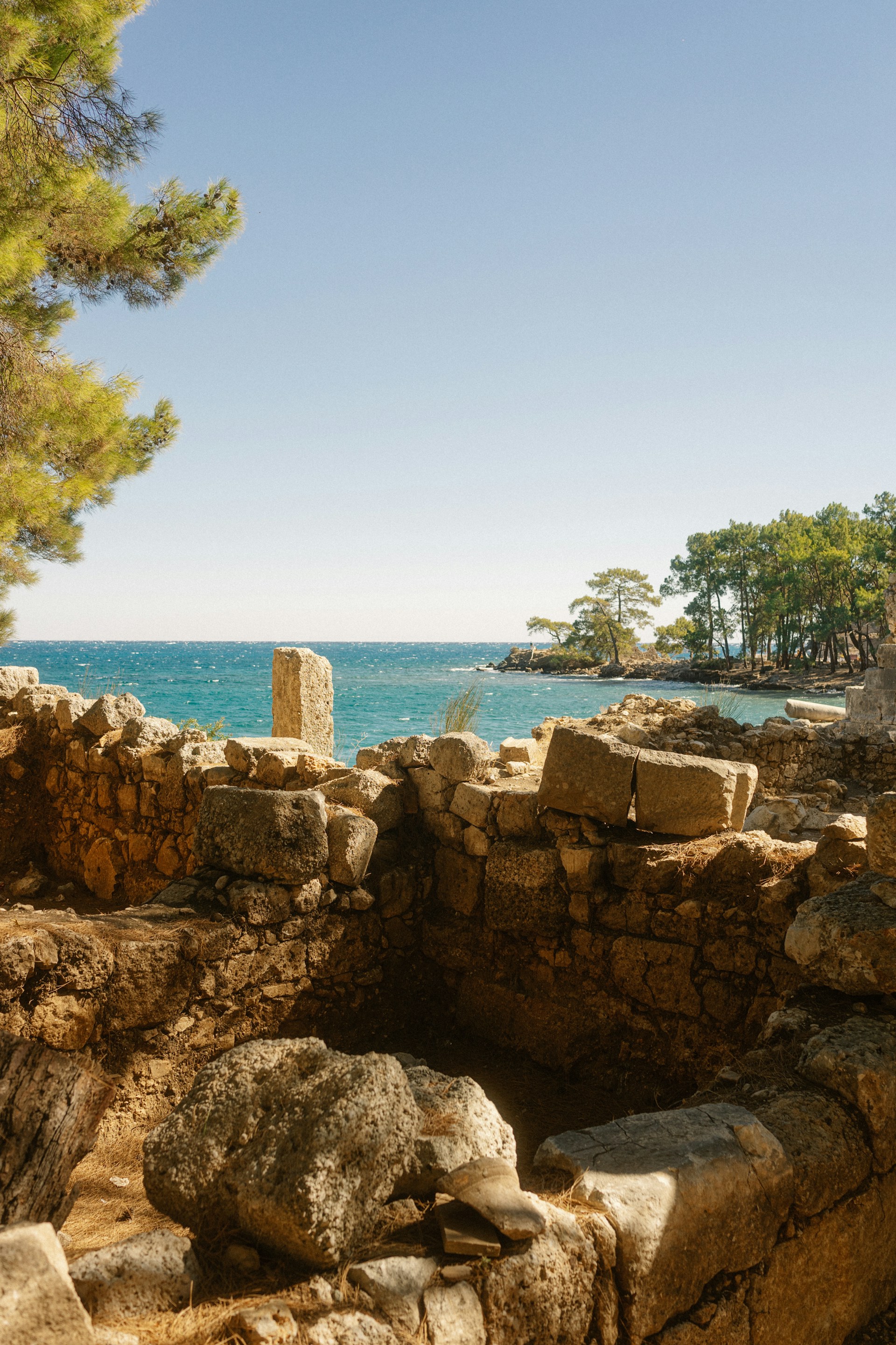 A view of the ocean from the ruins of a building