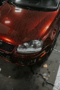 A red car parked in a parking space