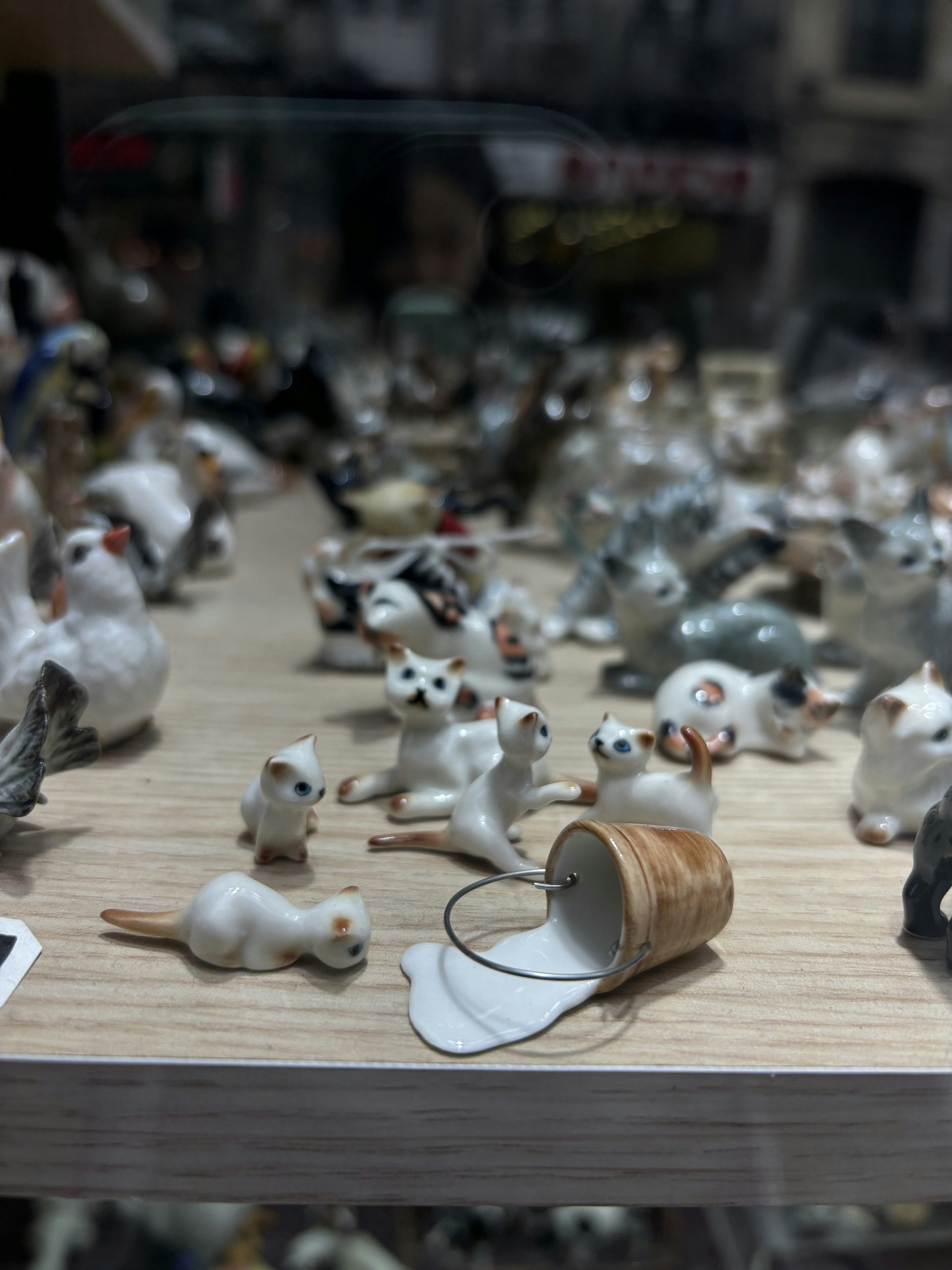 A display case filled with lots of different types of figurines