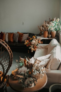 A living room filled with lots of furniture and flowers