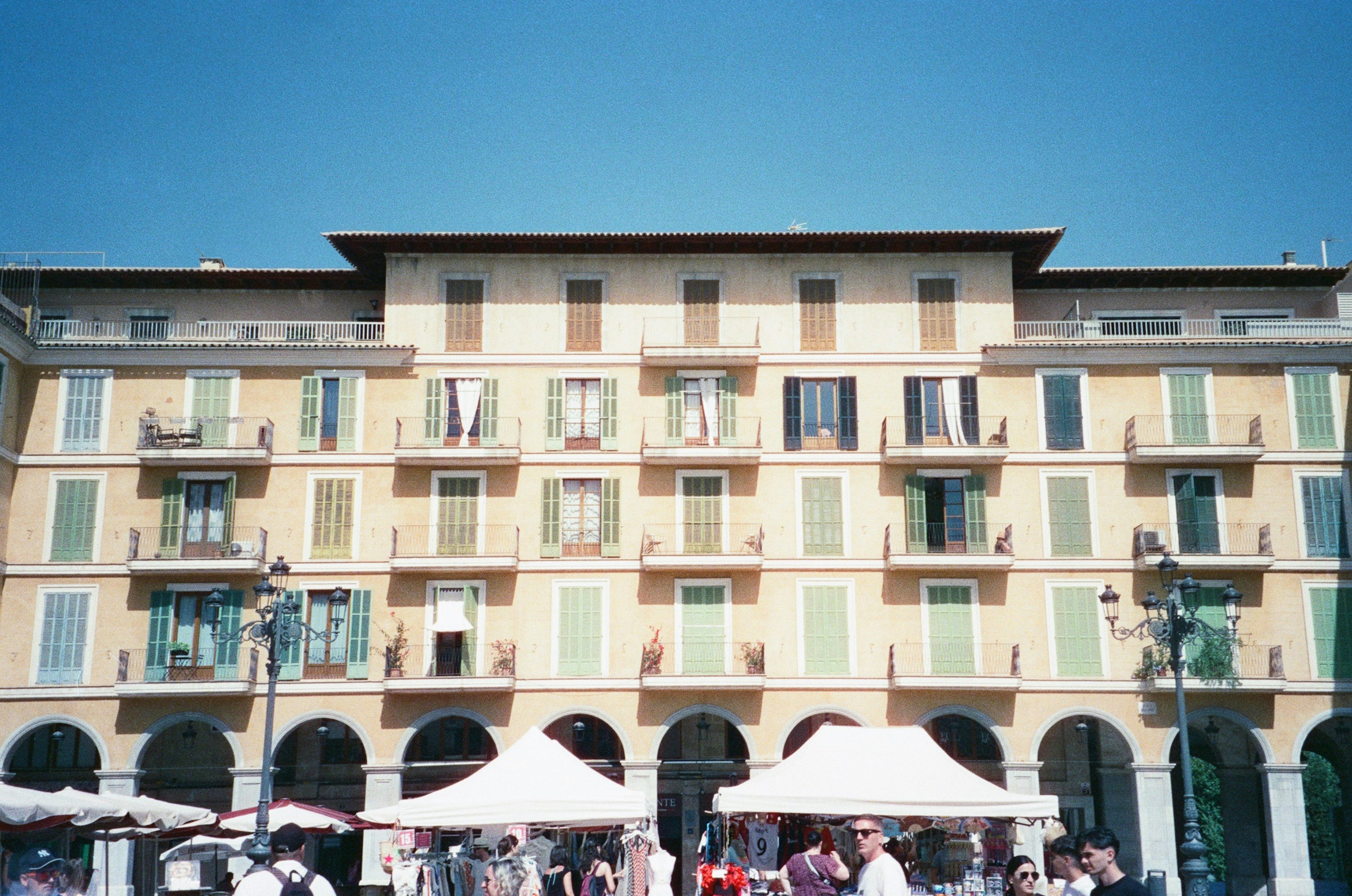 A group of people standing in front of a tall building