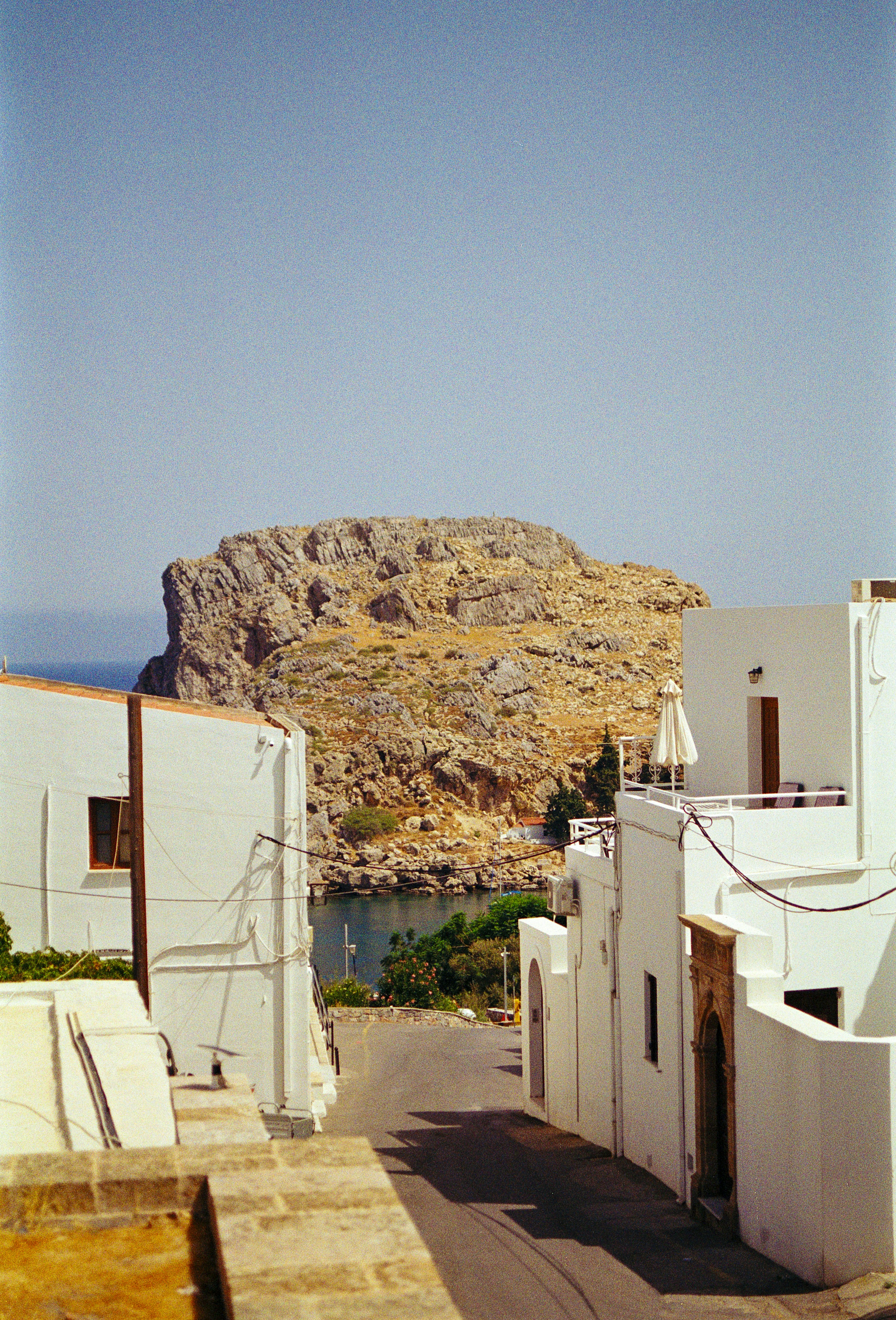 A street with a mountain in the background