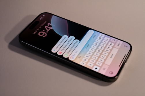 A close up of a cell phone with a keyboard on it